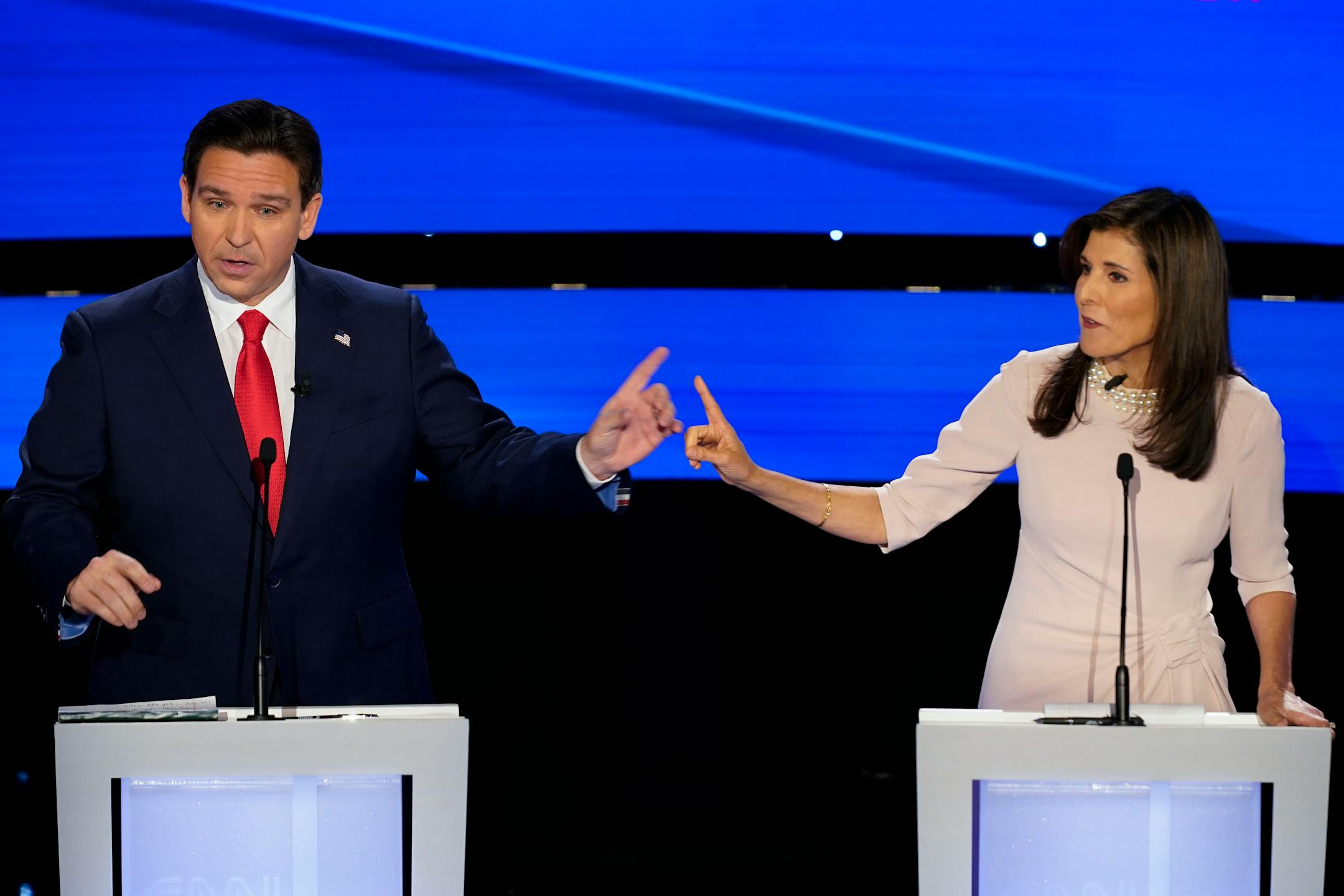 FILE - Former UN Ambassador Nikki Haley, right and Florida Gov. Ron DeSantis, left, pointing at each other during the CNN Republican presidential debate at Drake University in Des Moines, Iowa, Jan. 10, 2024. As Republican primary voters prepare to cast ballots for who they believe should lead the U.S. into its future, leading candidates are struggling to discuss key elements of the nation's past. DeSantis, Haley and former President Donald Trump have all raised eyebrows with rhetoric on the Civil War and slavery. (AP Photo/Andrew Harnik, File)