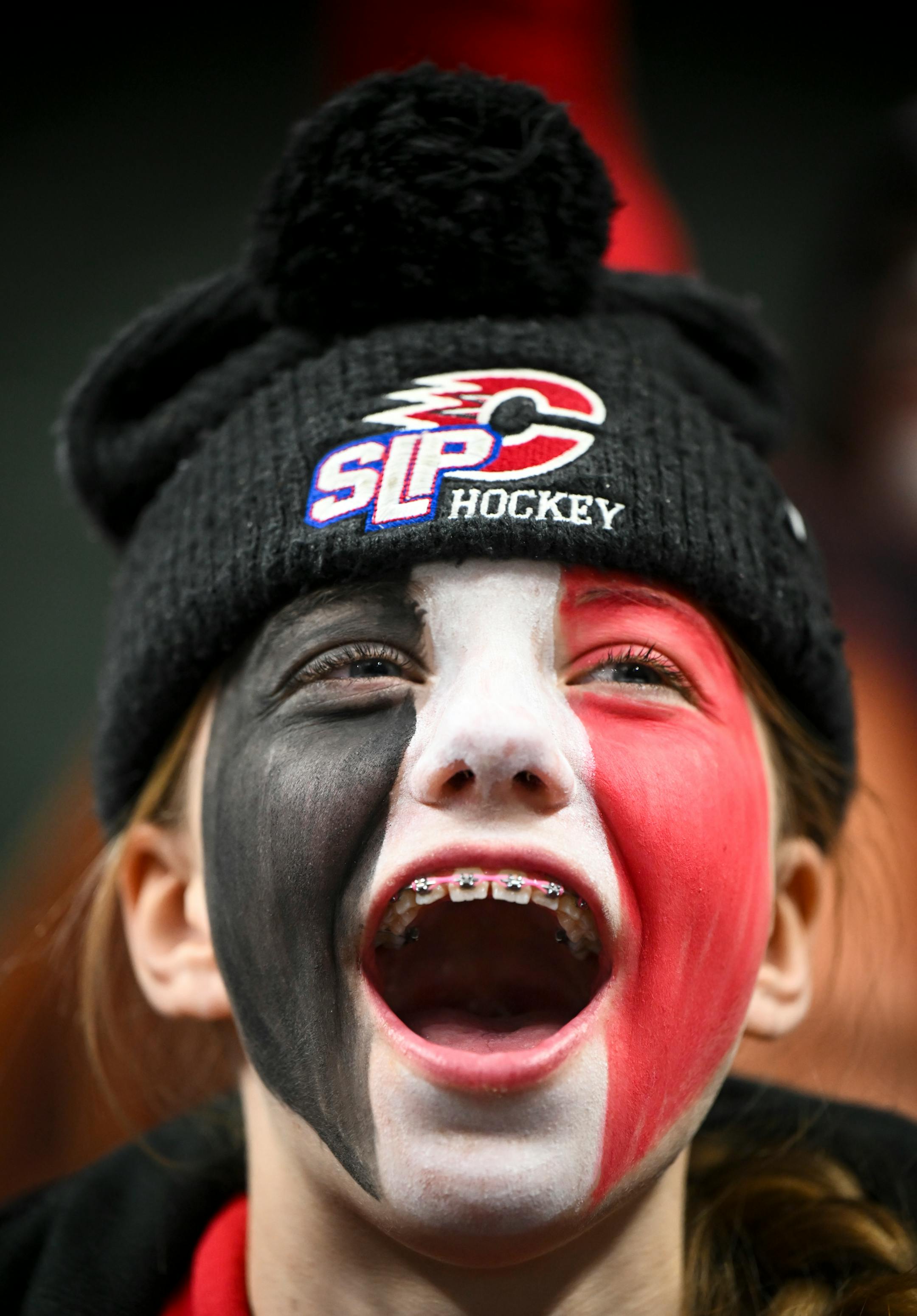 "I wanna win," said Jozie Kelzenberg, 12, a 6th grader at Centennial Middle School and a hockey player, while cheering on her team against Minnetonka before the start of a 2A girls' hockey state tournament quarterfinal game.