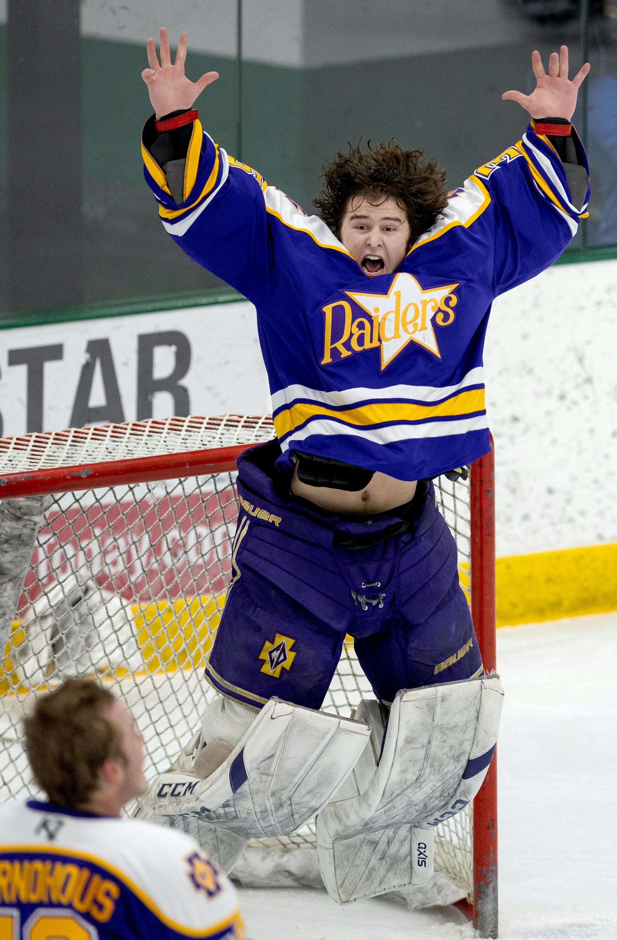Cretin-Derham Hall goalie Leo Miller (35) celebrates at the end of the boy's hockey section 3 Class 2A Finals.