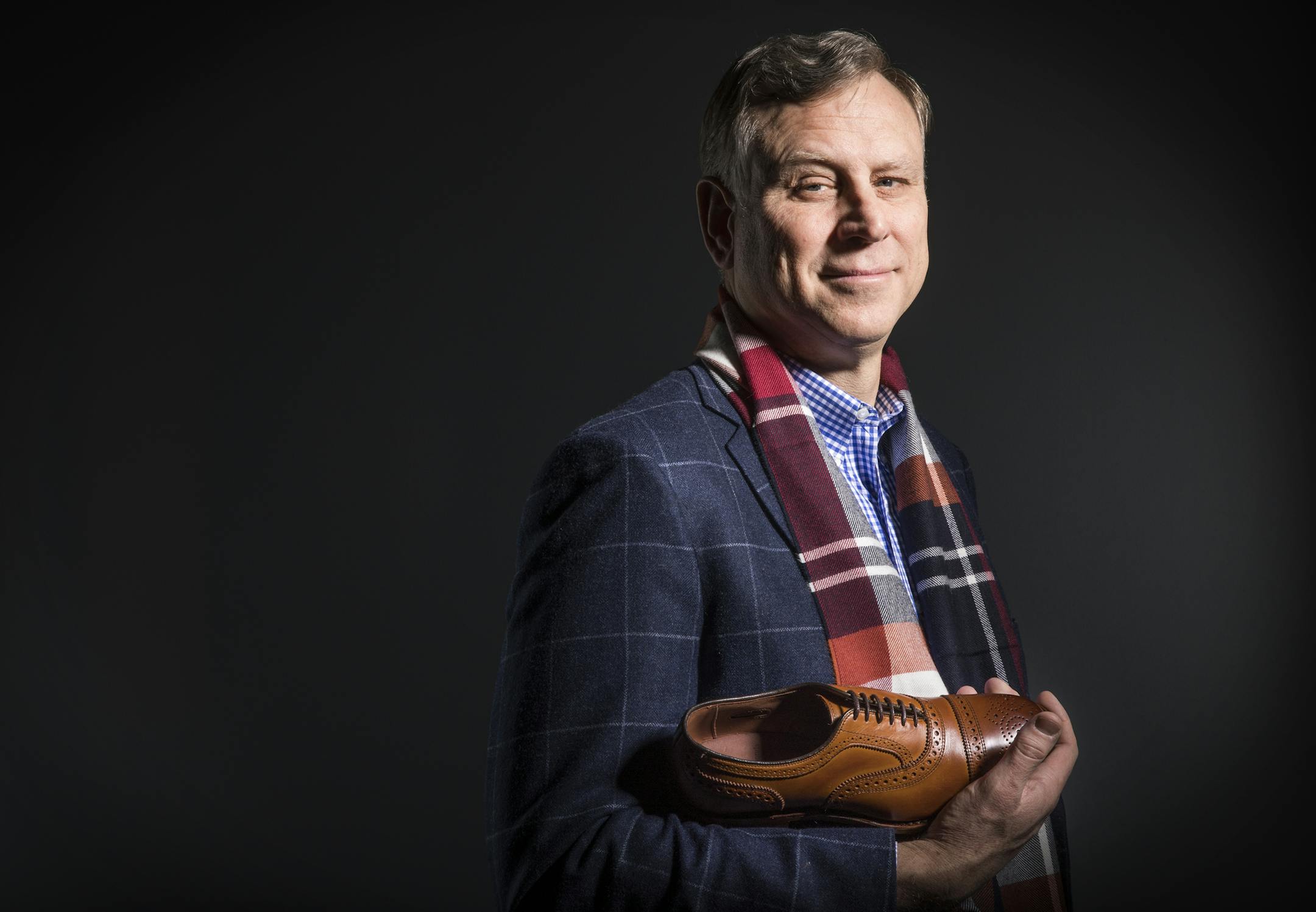 CEO Paul Grangaard of Allen Edmond Shoes. ] (Leila Navidi/Star Tribune) leila.navidi@startribune.com BACKGROUND INFORMATION: CEO Paul Grangaard of Allen Edmond Shoes poses for a photo wearing and holding Allen Edmond products in the Star Tribune studio on Thursday, January 5, 2017. Grangaard talks about the sale of the company for $250 million and what he learned from the eight-year-turnaround of the near-bankrupt shoemaker, and the workers' contributions to the cause.