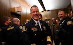 Newly sworn-in St. Paul Police Chief Axel Henry was all smiles as he was greeted by fellow St. Paul Police on Wednesday.