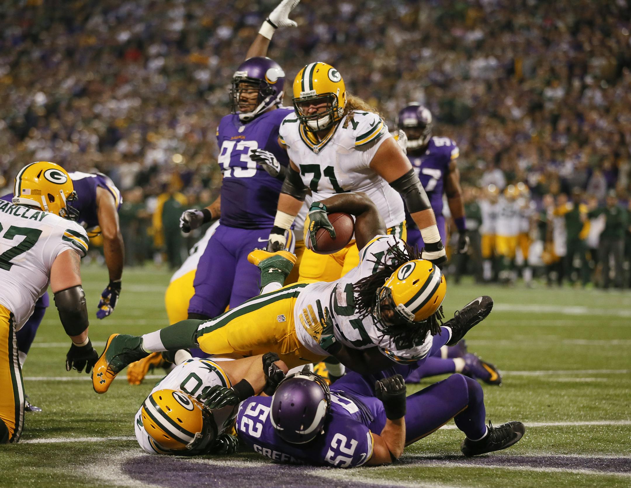 Packers rookie Eddie Lacy plowed through the Vikings’ Everson Griffen on a 1-yard touchdown run Sunday night, capping a 15-play, 80-yard drive in which Green Bay converted three times on third down and once on fourth-and-3.