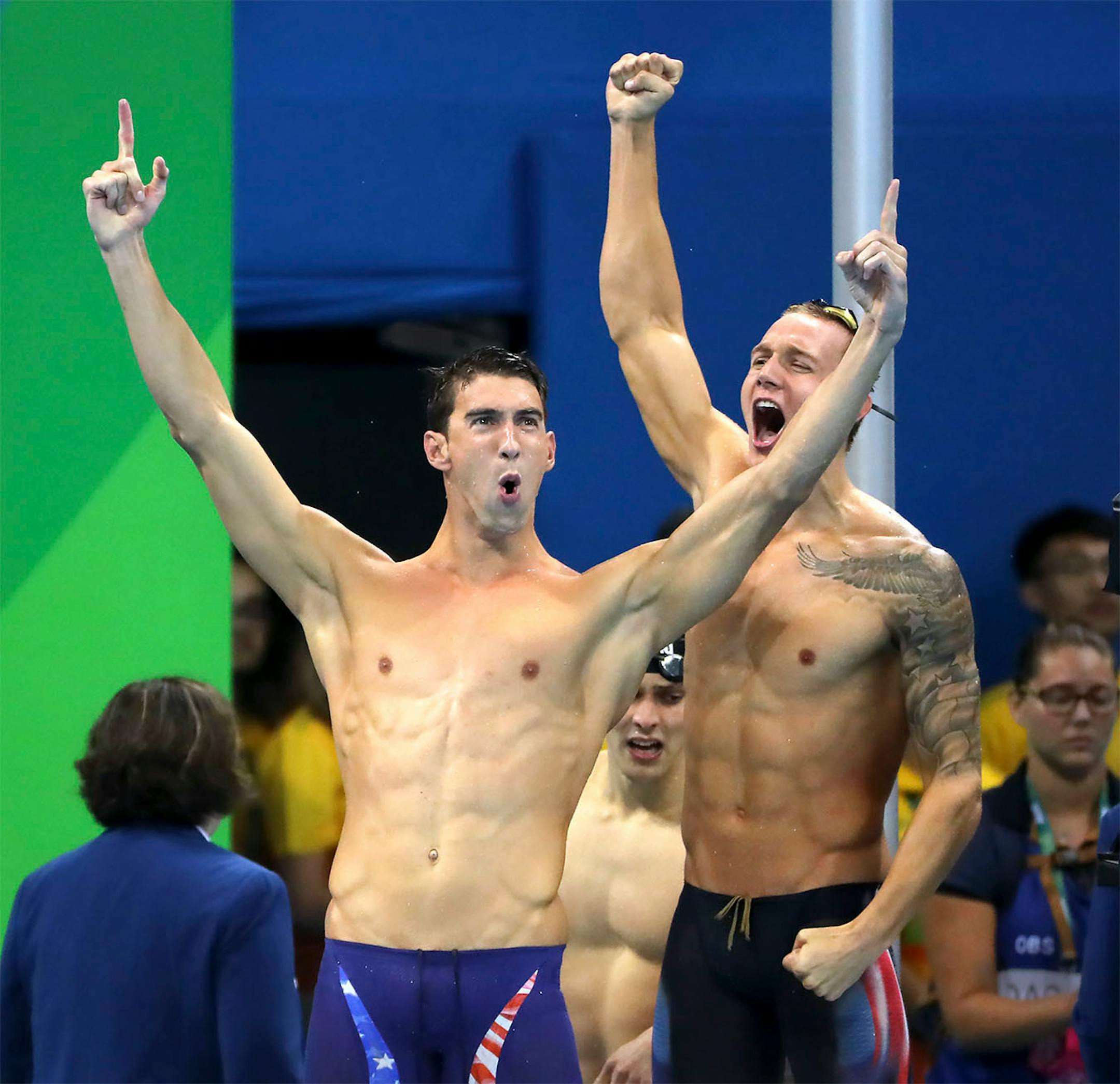Michael Phelps celebrates their gold medal victory in the men's 1x400 freestyle relay.