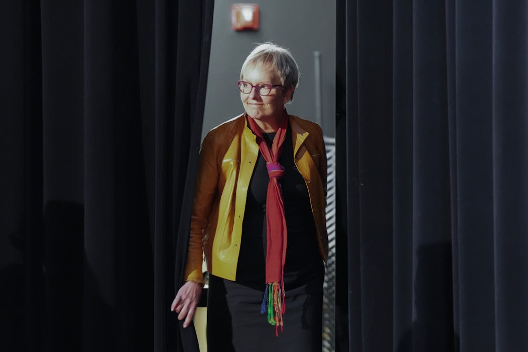 Laura Bloomberg, president of Cleveland State University, walks on stage at a forum held on the University of Minnesota's Twin Cities campus. She's one of three finalists in the running to become the next University of Minnesota president.