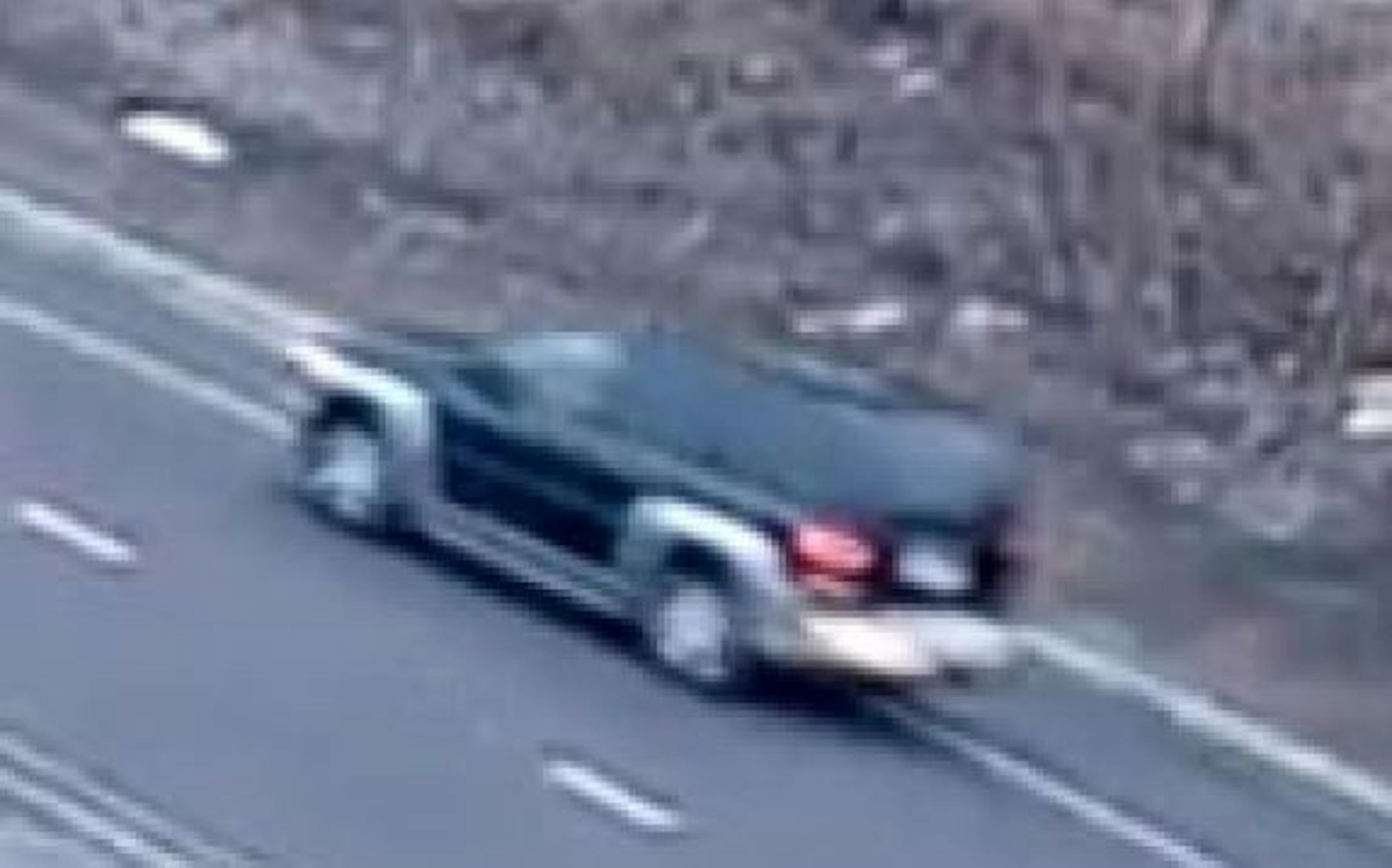 Police say the vehicle of a road rage suspect is an older black Chevrolet Trailblazer with silver trim around the bottom, the wheels and the bumpers. Credit: Surveillance image provided by Golden Valley police