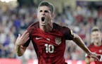 FILE - In this Oct. 6, 2017, file photo, United States' Christian Pulisic (10) celebrates his goal against Panama during the first half of a World Cup