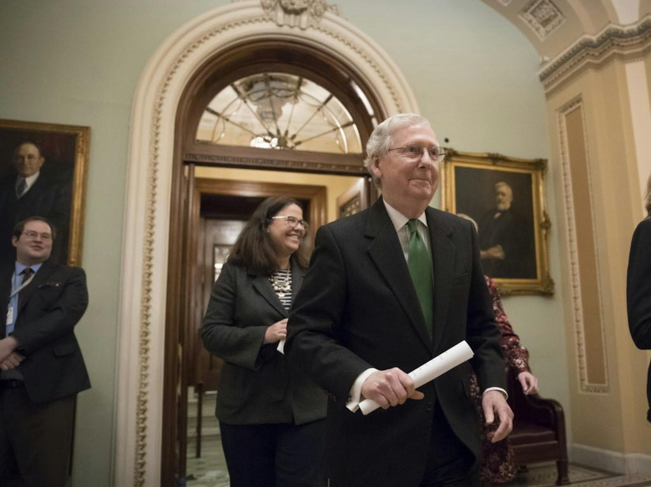 Senate Majority Leader Mitch McConnell, R-Ky., leaves the chamber after announcing an agreement in the Senate on a two-year budget deal.
