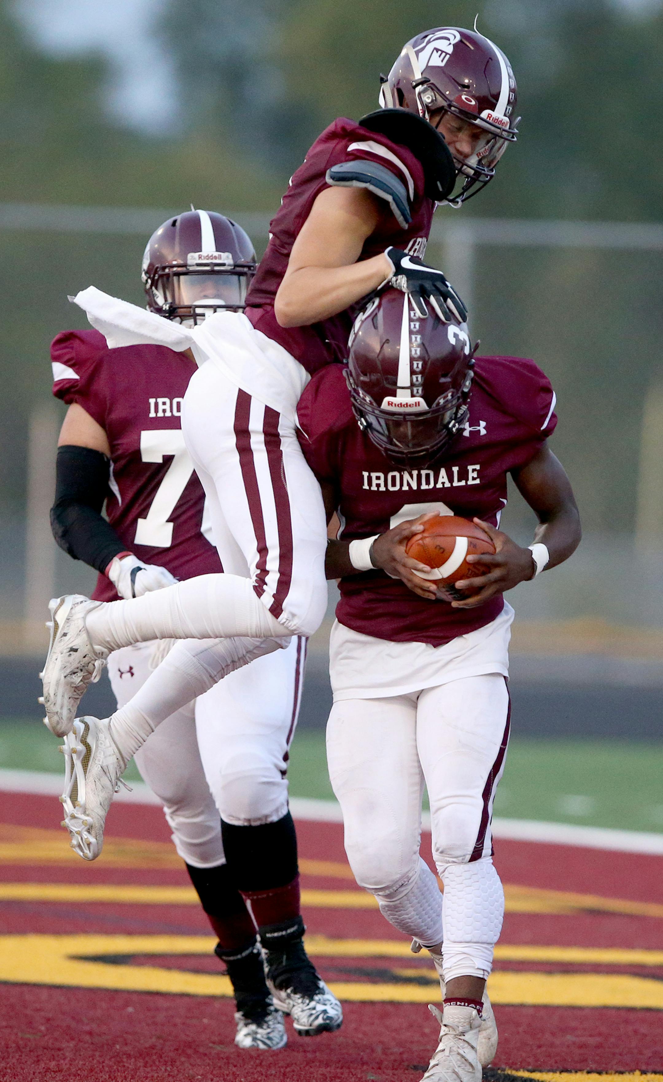 After scooping up a fumble and returning it for a three-yard touchdown Irondale safety Joshua Natere (3) is mobbed by teammate Nicholas Ellingson against Forest Lake during the first quarter Friday, Sept. 15, 2017, at Irondale High in New Brighton, MN.] DAVID JOLES ï david.joles@startribune.com Forest Lake at Irondale