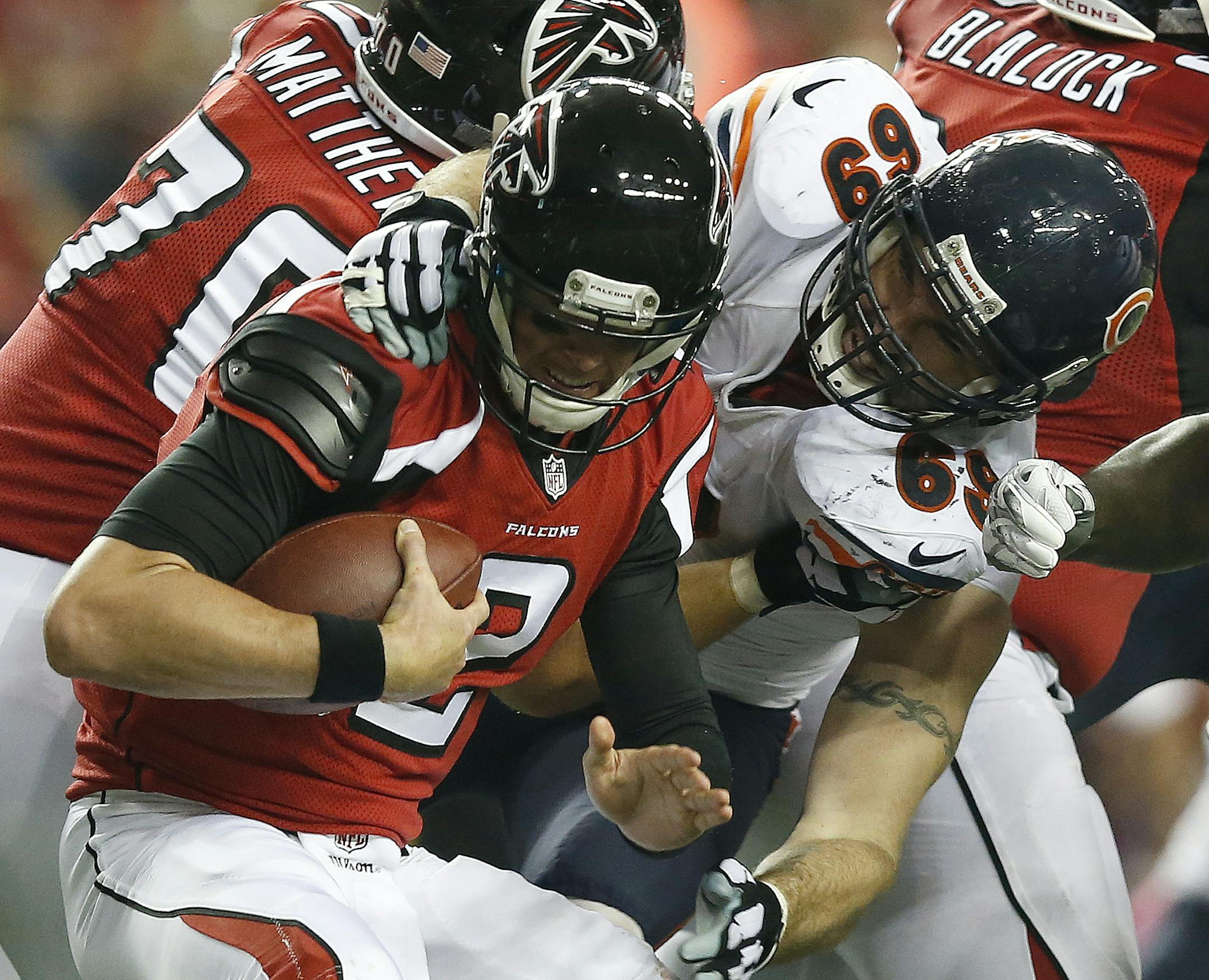 Atlanta Falcons quarterback Matt Ryan (2) is sacked by Chicago Bears defensive end Jared Allen (69) during the second half of an NFL football game, Sunday, Oct. 12, 2014, in Atlanta. The Chicago Bears won 27-13. (AP Photo/Brynn Anderson)