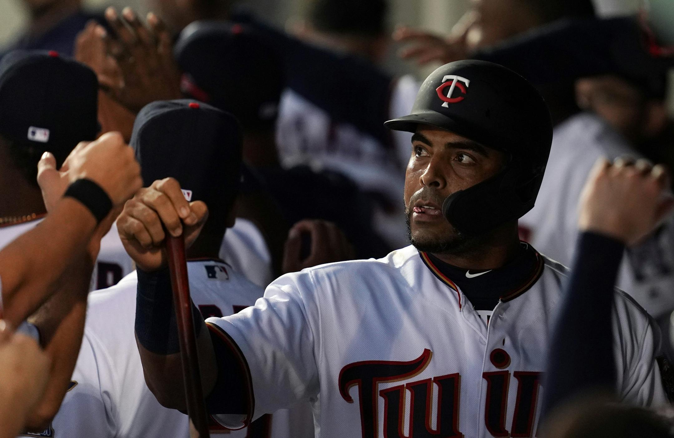 Minnesota Twins designated hitter Nelson Cruz (23) celebrated with his teammates in the dugout after scoring during Saturday's game. ] ANTHONY SOUFFLE • anthony.souffle@startribune.com The Minnesota Twins played the Tampa Bay Rays in their first home Spring Training game Saturday, Feb. 23, 2019 at The CenturyLink Sports Complex's Hammond Stadium in Fort Myers, Fla. ORG XMIT: MIN1902232053521791 ORG XMIT: MIN1903031848595032