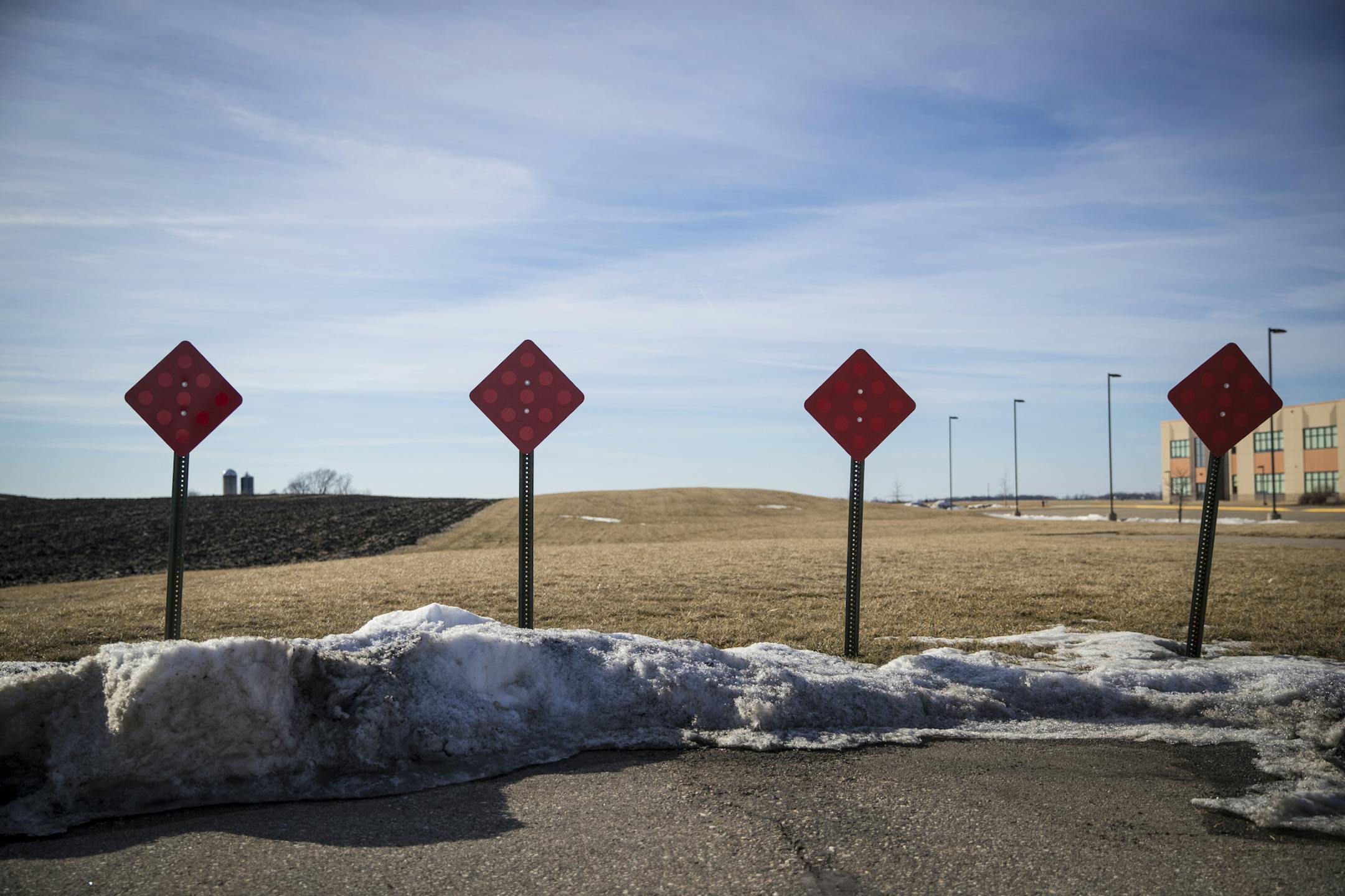 The end of a road next to the elementary school at right and farmland at left that has never been developed. Photographed on Wednesday, February 15, 2017 in Elko, Minn. ] RENEE JONES SCHNEIDER • renee.jones@startribune.com