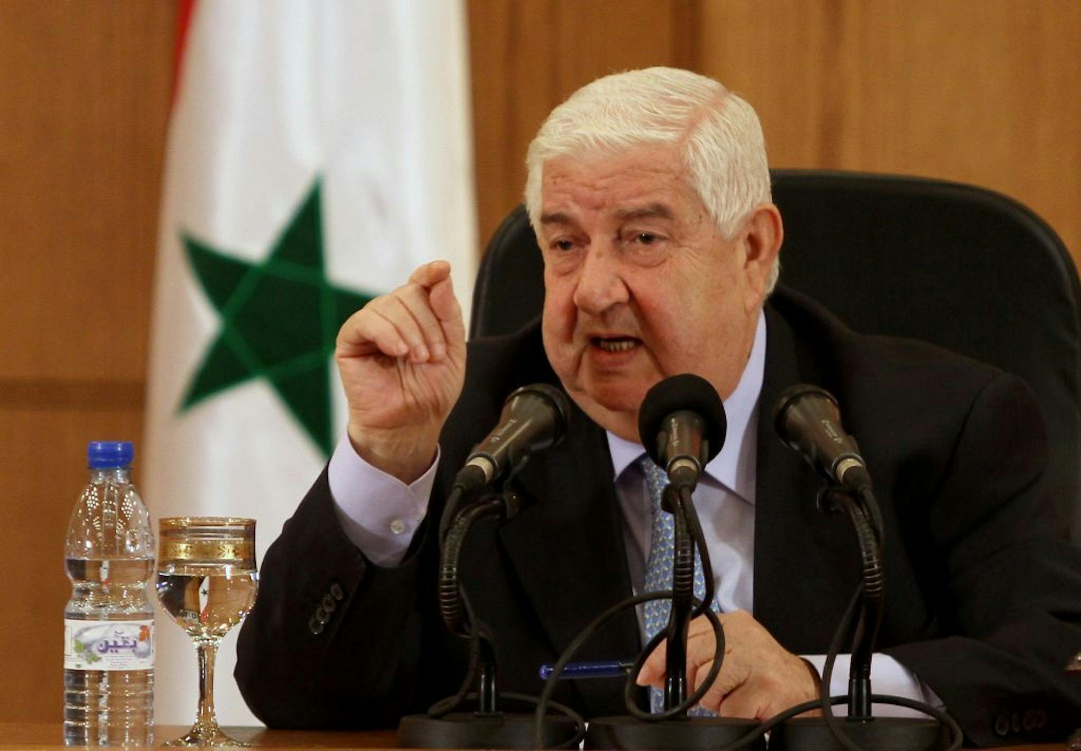 Syrian Foreign Minister Walid al-Moallem speaks during a press conference in Damascus, Syria on Tuesday, August 27, 2013. Syria's foreign minister said Tuesday his country would defend itself using "all means available" in case of a U.S. strike, denying his government was behind an alleged chemical weapons attack near Damascus and challenging Washington to present proof backing up its accusations.