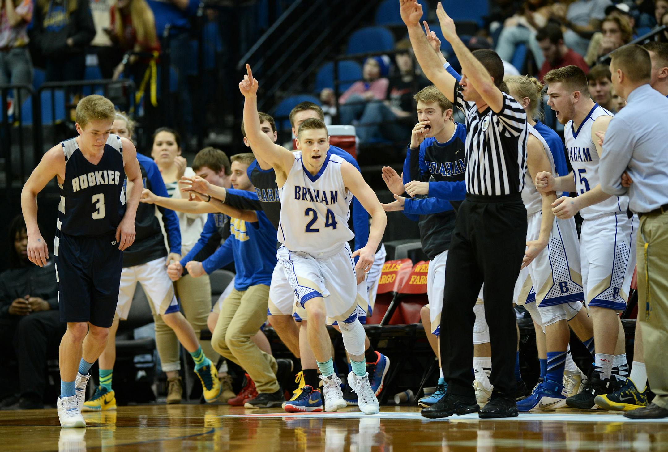 Braham guard Chris Olson (24) celebrated in front of his team's bench after hitting a 3-pointer in the second half against Jackson County Central in the 2A championship game Saturday. ] (AARON LAVINSKY/STAR TRIBUNE) aaron.lavinsky@startribune.com Braham played Jackson County Central in the Class 2A boys’ basketball championship game on Saturday, March 12, 2016 at Target Center in Minneapolis, Minn.