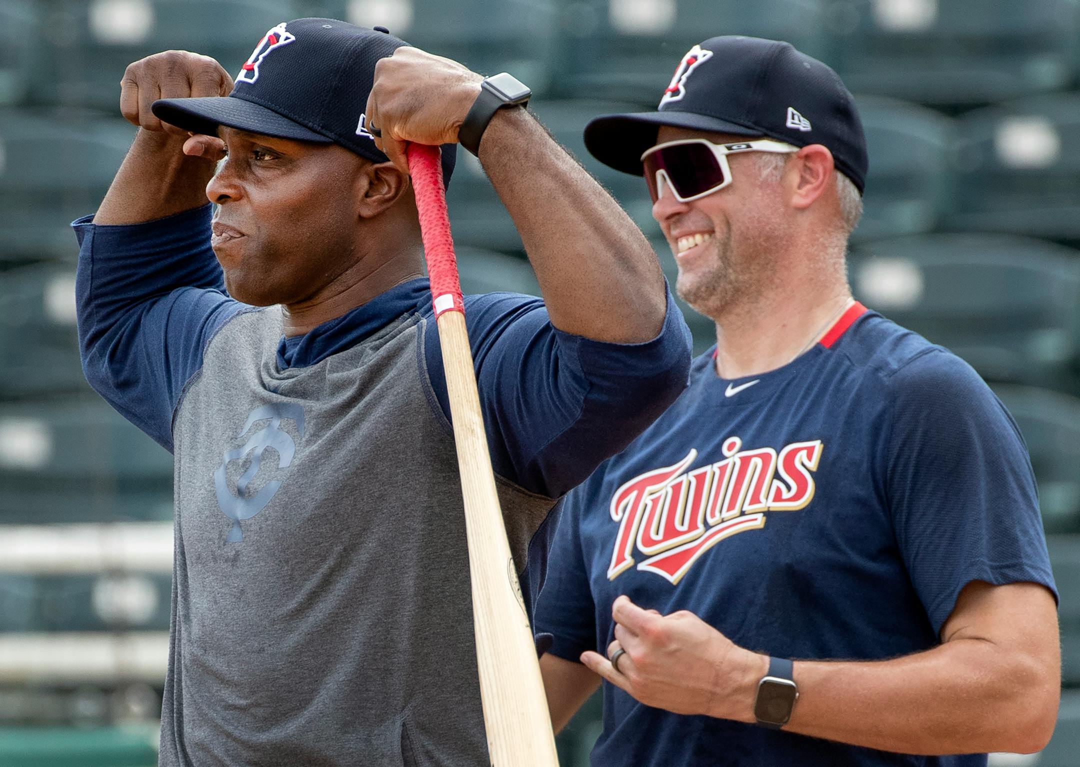 Minnesota Twins special coaches Torii Hunter and Michael Cuddyer joked after hitting balls to outfielders during practice on Wednesday in Fort Myers.