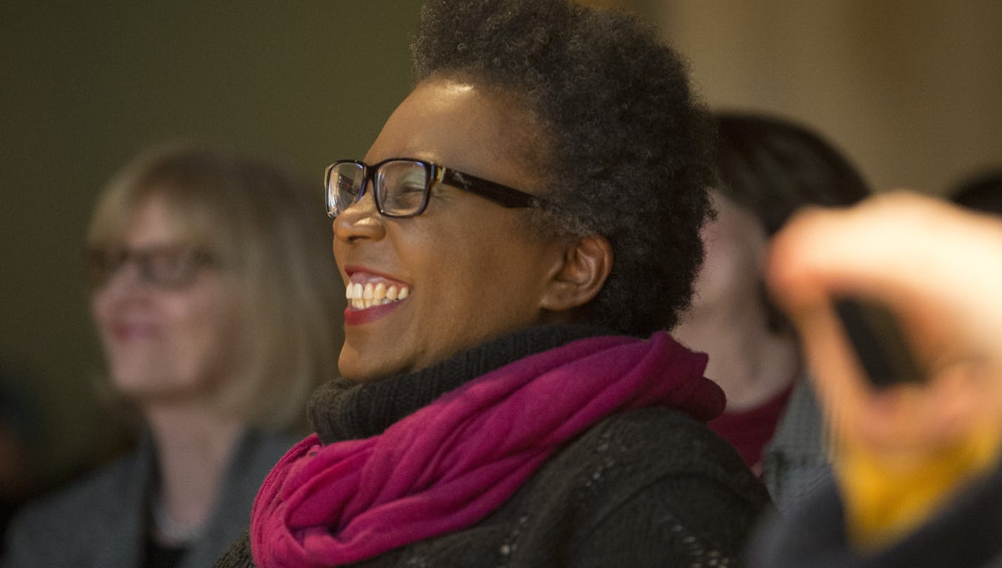 Poet Claudia Rankine smiles as she is introduced by St. Paul author Marlon James on Friday night at the Loft Literary Center. ] (Aaron Lavinsky | StarTribune) St. Paul author Marlon James introduces poet Claudia Rankine at the Loft Literary Center on Friday, Jan. 30, 2015 in Minneapolis. She is published by Graywolf Press, and her book, "Citizen," was a finalist for the National Book Award. It is currently a finalist for the National Book Critics Circle Award in two categories.