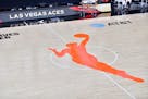 The WNBA logo is seen on the court before a playoff game between the Las Vegas Aces and the Connecticut Sun.