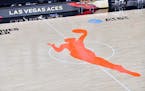 The WNBA logo is seen on the court before a playoff game between the Las Vegas Aces and the Connecticut Sun.