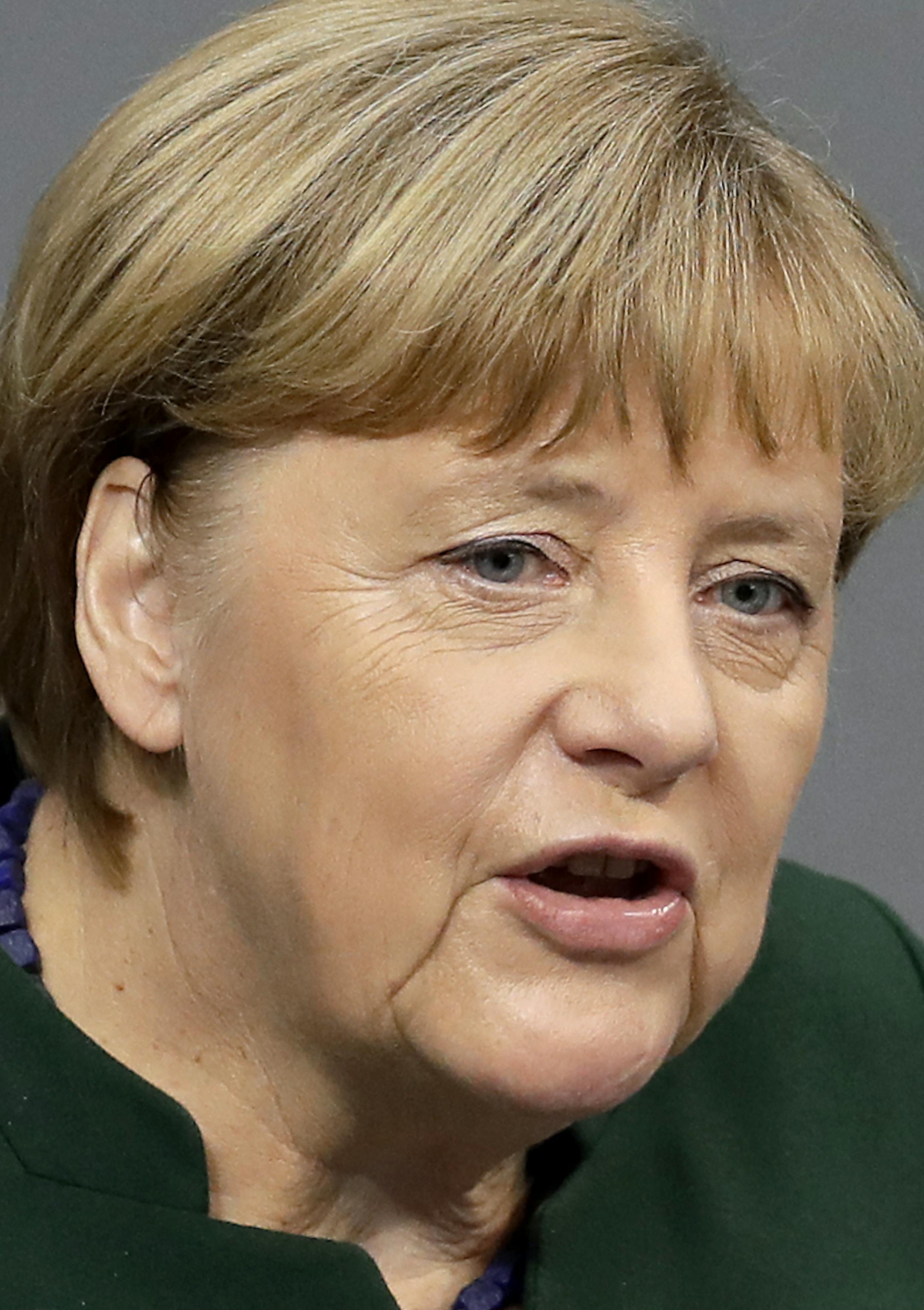 German Chancellor Angela Merkel speaks during a budget debate as part of a meeting of the German Federal Parliament, Bundestag, at the Reichstag building in Berlin, Germany, Wednesday, Nov. 23, 2016. (AP Photo/Michael Sohn) ORG XMIT: SOB111