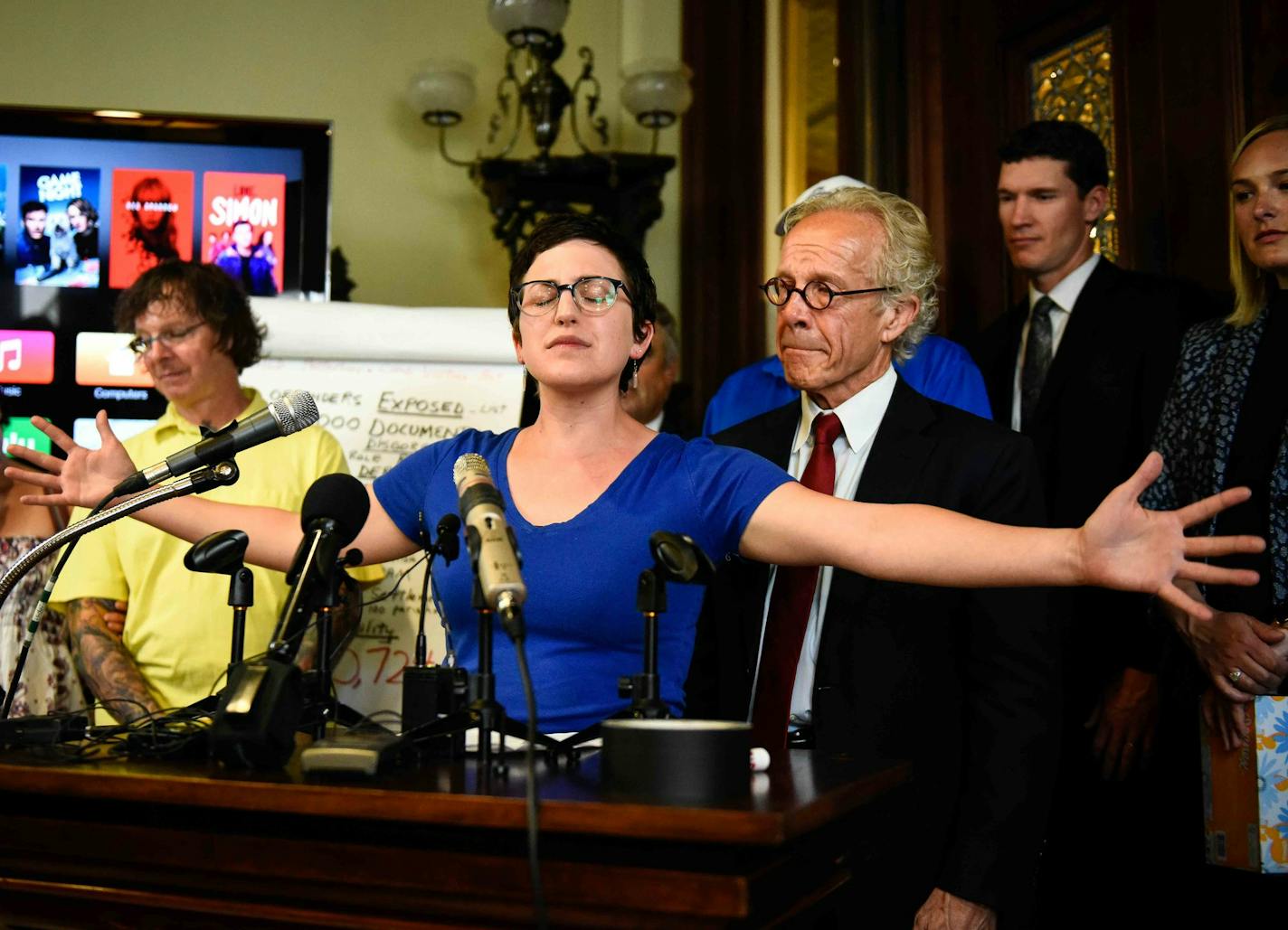 Childhood clergy abuse survivor Marie Mielke gestured while speaking about her abuse and the settlement reached between abuse survivors and the Archdiocese of St. Paul and Minneapolis on Thursday afternoon.