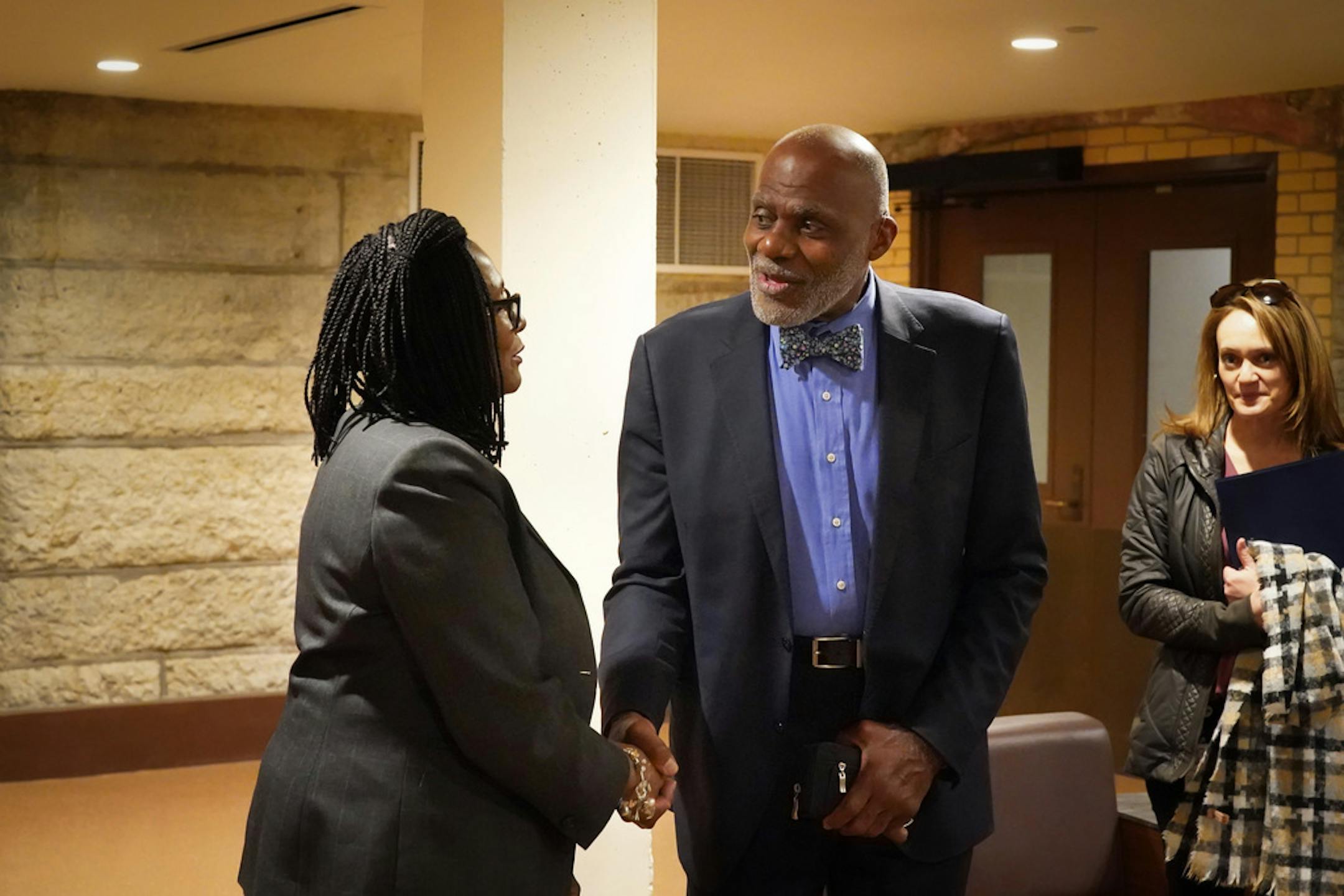 Former Minnesota Supreme Court Justice Alan Page paused to talk with Rep. Rena Moran, DFL-St. Paul, a supporter of the amendment.