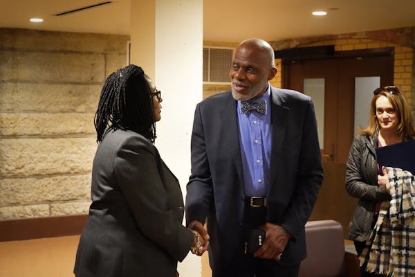 Former Minnesota Supreme Court Justice Alan Page paused to talk with Rep. Rena Moran, DFL-St. Paul, a supporter of the amendment.