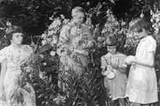 Alvina Hammer Rutzen picked flowers with students in the garden of the Hammer School in Wayzata. A century after she founded her first school for chil