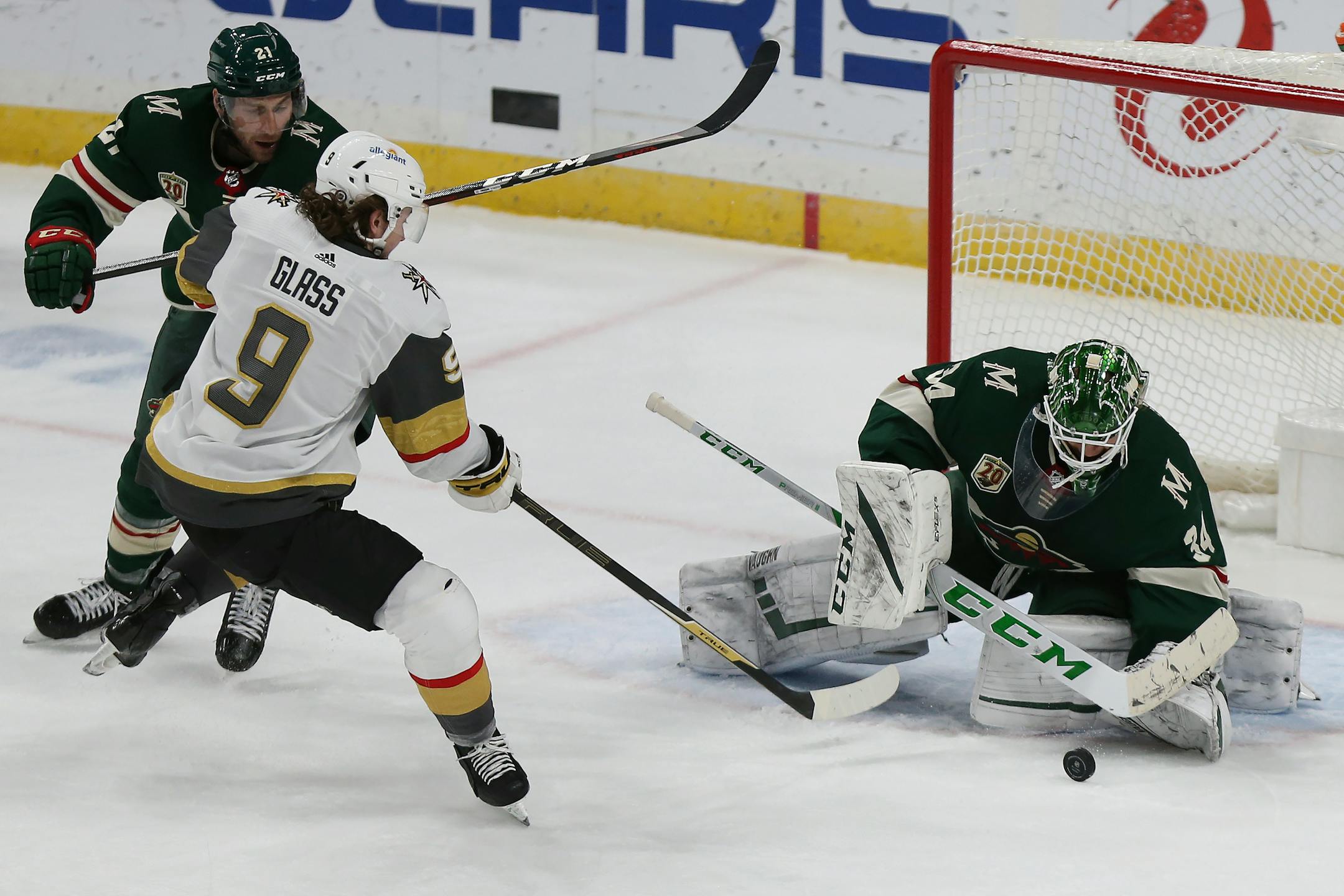Minnesota Wild's goalie Kaapo Kahkonen (34) blocks a shot-attempt by Vegas Golden Knights' Cody Glass (9) in the third period of an NHL hockey game Monday, March 8, 2021, in St. Paul, Minn. (AP Photo/Stacy Bengs)