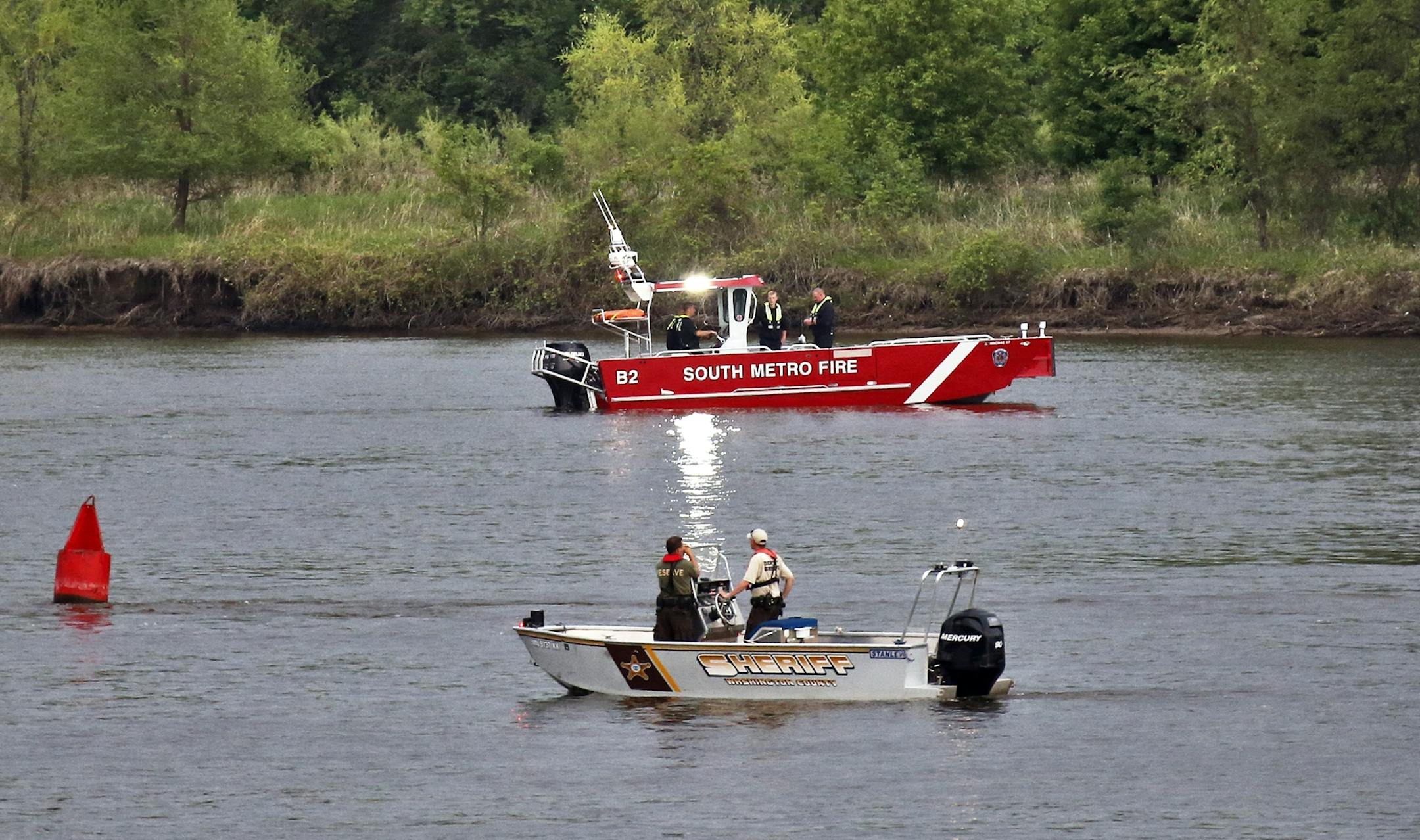 Rescue workers search Mississippi River near Lions Levee Park in St. Paul Park for possible drowning victim.