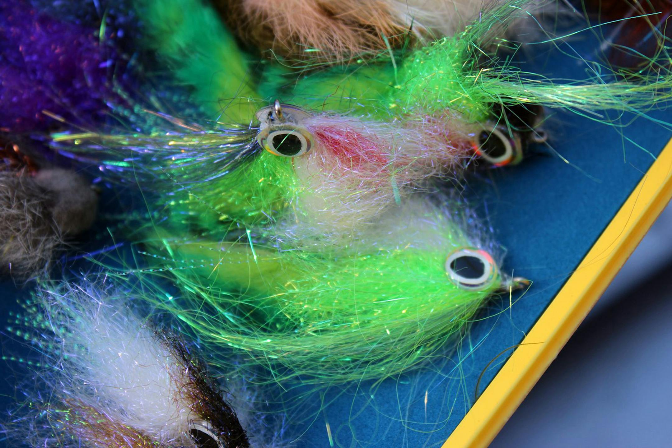 Fishing flies with shiny bits are designed to entice the trout even in the depths of January. Boyne Outfitters leads January fly fishing trips for the diehards and the curious. (Ellen Creager/Detroit Free Press/MCT) ORG XMIT: 1133750 ORG XMIT: MIN1301202306410688