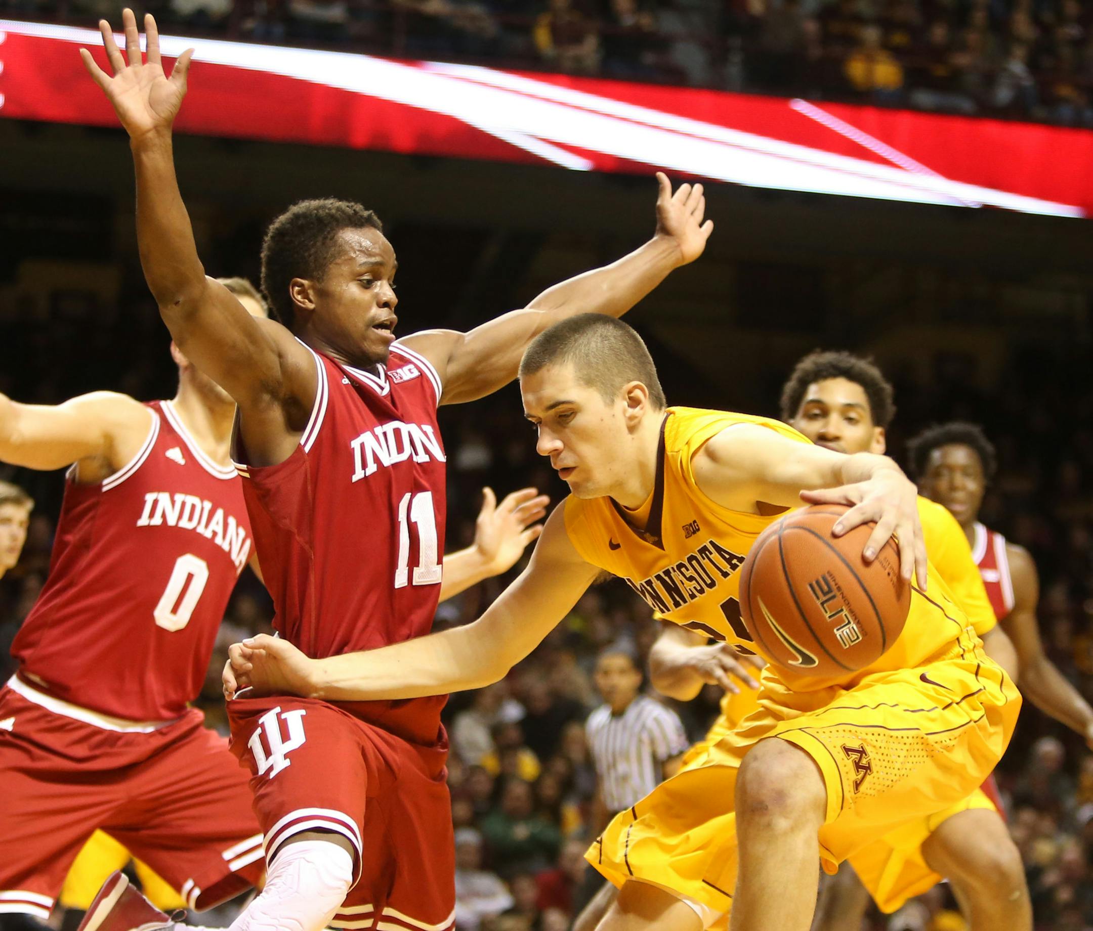 The University of Minnesota's Joey King (24) tries to drive around the University of Indiana's Kevin Yogi Ferrell (11) during the second half of the Gophers 70-63 loss Saturday, Jan. 16, 2016, at Williams Arena in Minneapolis, MN. ](DAVID JOLES/STARTRIBUNE)djoles@startribune.com the University of Indiana versus the University of Minnesota.