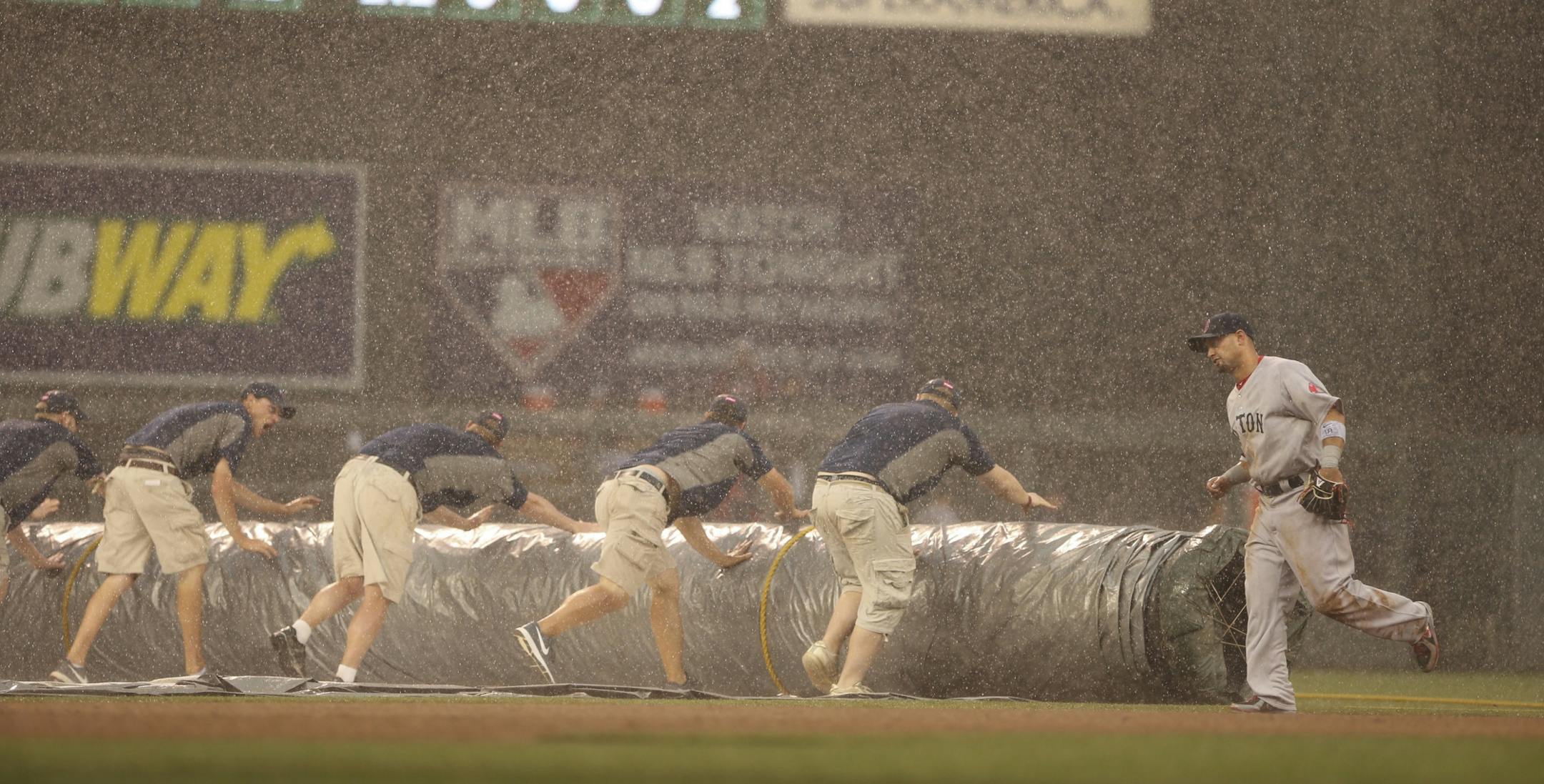 The Minnesota Twins faced the Boston Red Sox in an game Sunday afternoon, May 19, 2013 at Target Field in Minneapolis. The Red Sox' Shane Victorino jogged off the field when play was suspended due to rain in the 7th inning with the Twins about to bat Sunday afternoon.