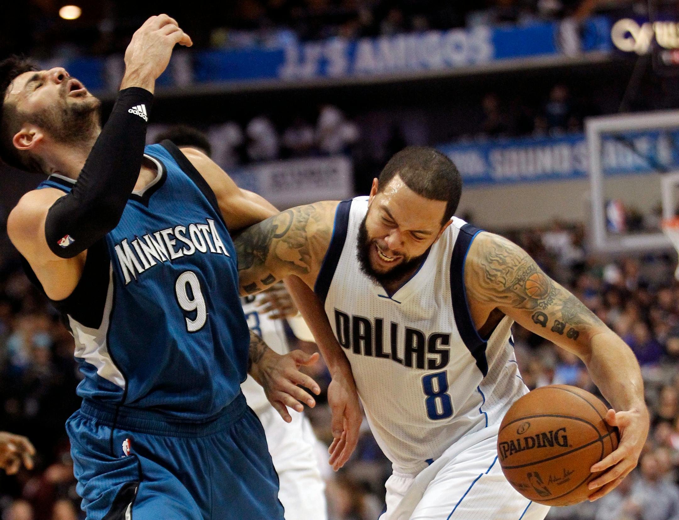 Mavericks guard Deron Williams (8) bumped Timberwolves guard Ricky Rubio while driving toward the basket during the second half Sunday.