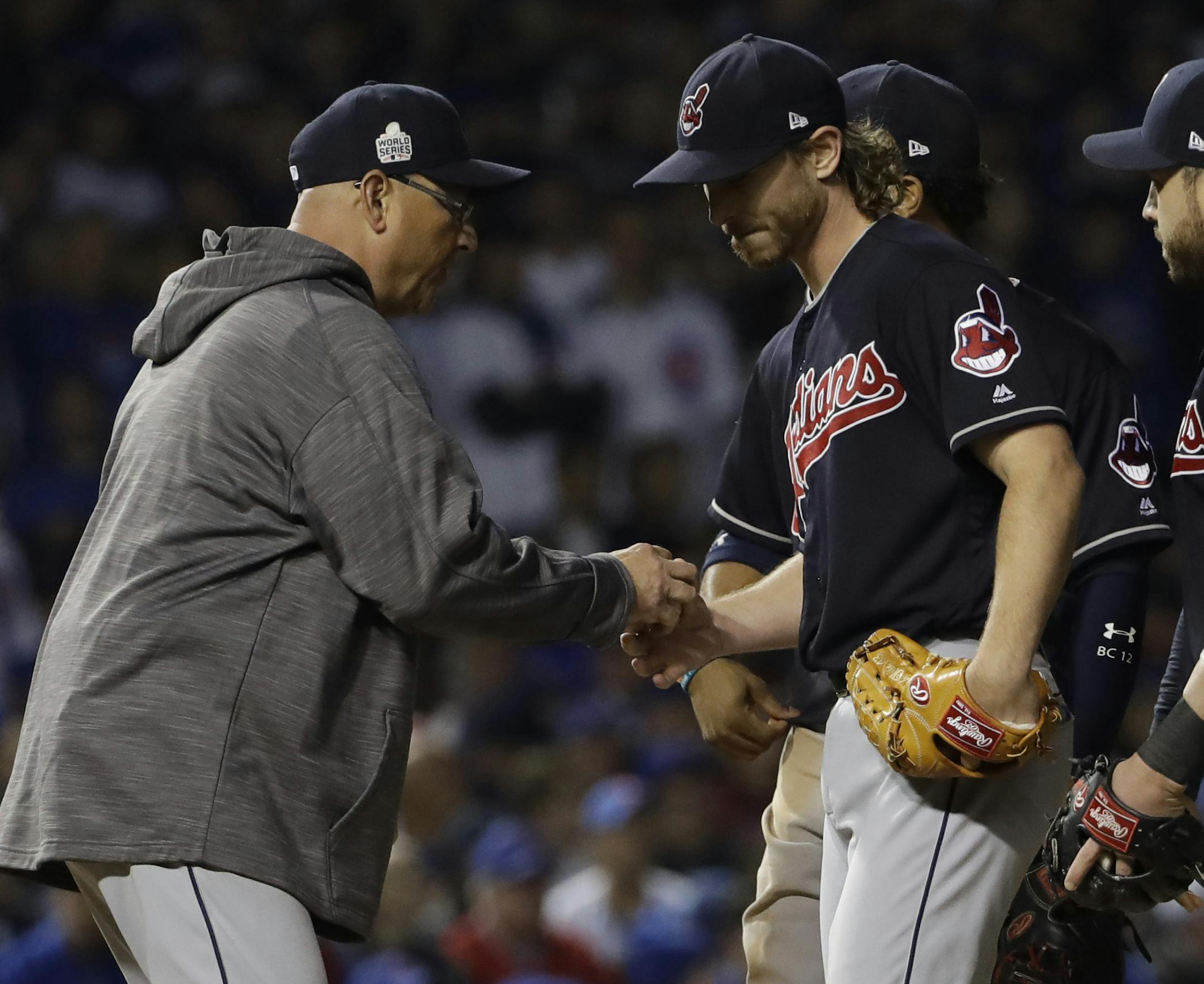 Cleveland Indians manager Terry Francona takes starting pitcher Josh Tomlin out of the game during the fifth inning of Game 3 of the Major League Baseball World Series against the Chicago Cubs Friday, Oct. 28, 2016, in Chicago. (AP Photo/David J. Phillip)