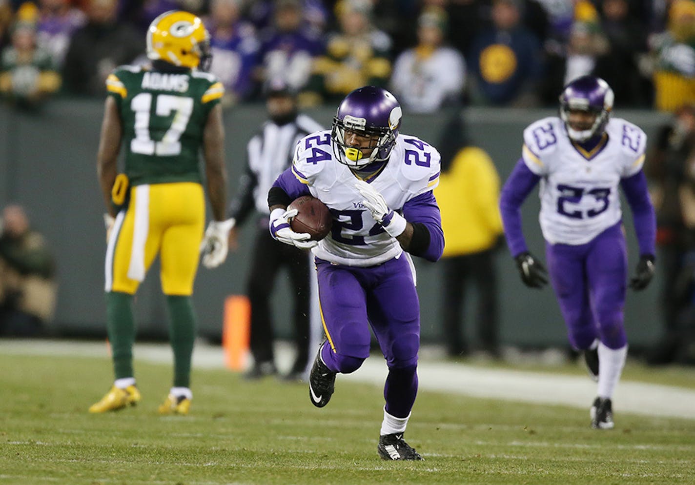 Minnesota Vikings cornerback Captain Munnerlyn (24) picked up a Aaron Rodgers fumble and ran it back for a 55 yard touchdown in the third quarter Sunday January 3, 2016 in Green Bay, Wisconsin.