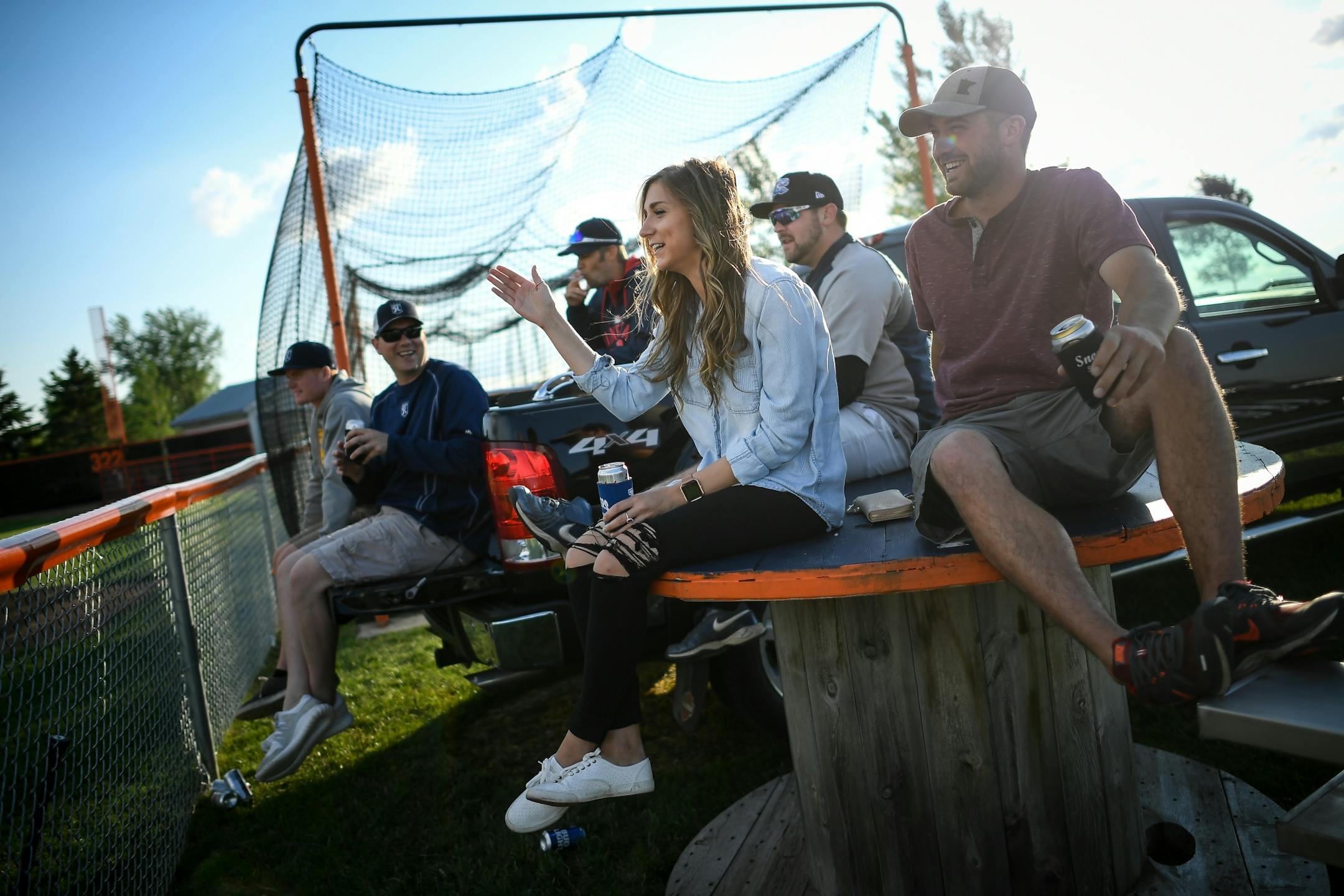 Sam Schlangen, center, joked about taking credit for her grandmother's home-made hamburger buns that are a thing of legend at St. Martin's ballpark. St. Martin's team roster has five Schlangens on it. She was attending the all star game and home run derby between the County Line League and the Stearns County League on Friday, June 30, 2017 in Elrosa, Minn.