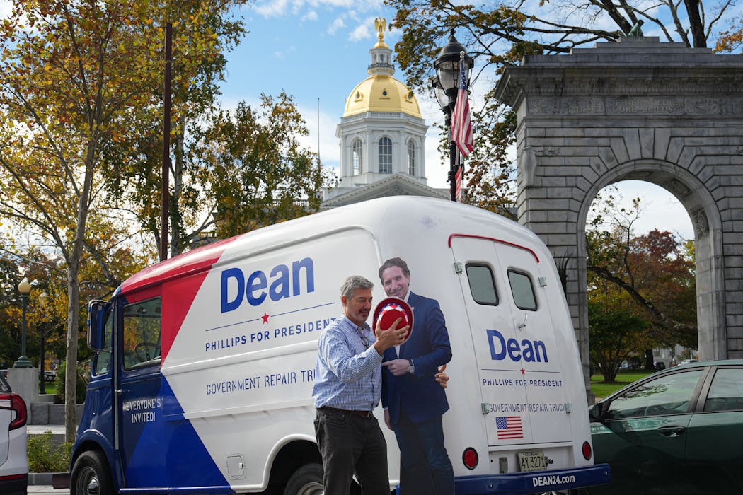 Dean Phillips volunteer Andrew Morrow set up the “government repair truck” outside the New Hampshire State House.