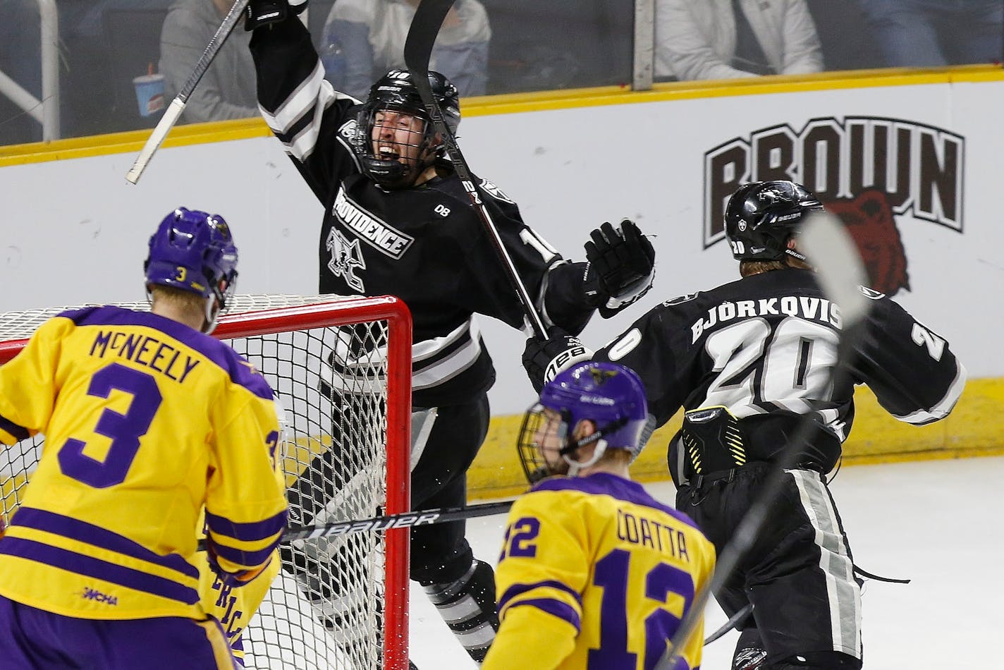 Providence's Scott Conway (10) celebrates the goal by teammate Kasper Björkqvist (20) as Minnesota State's Jack McNeely (3) and Max Coatta (12) look on