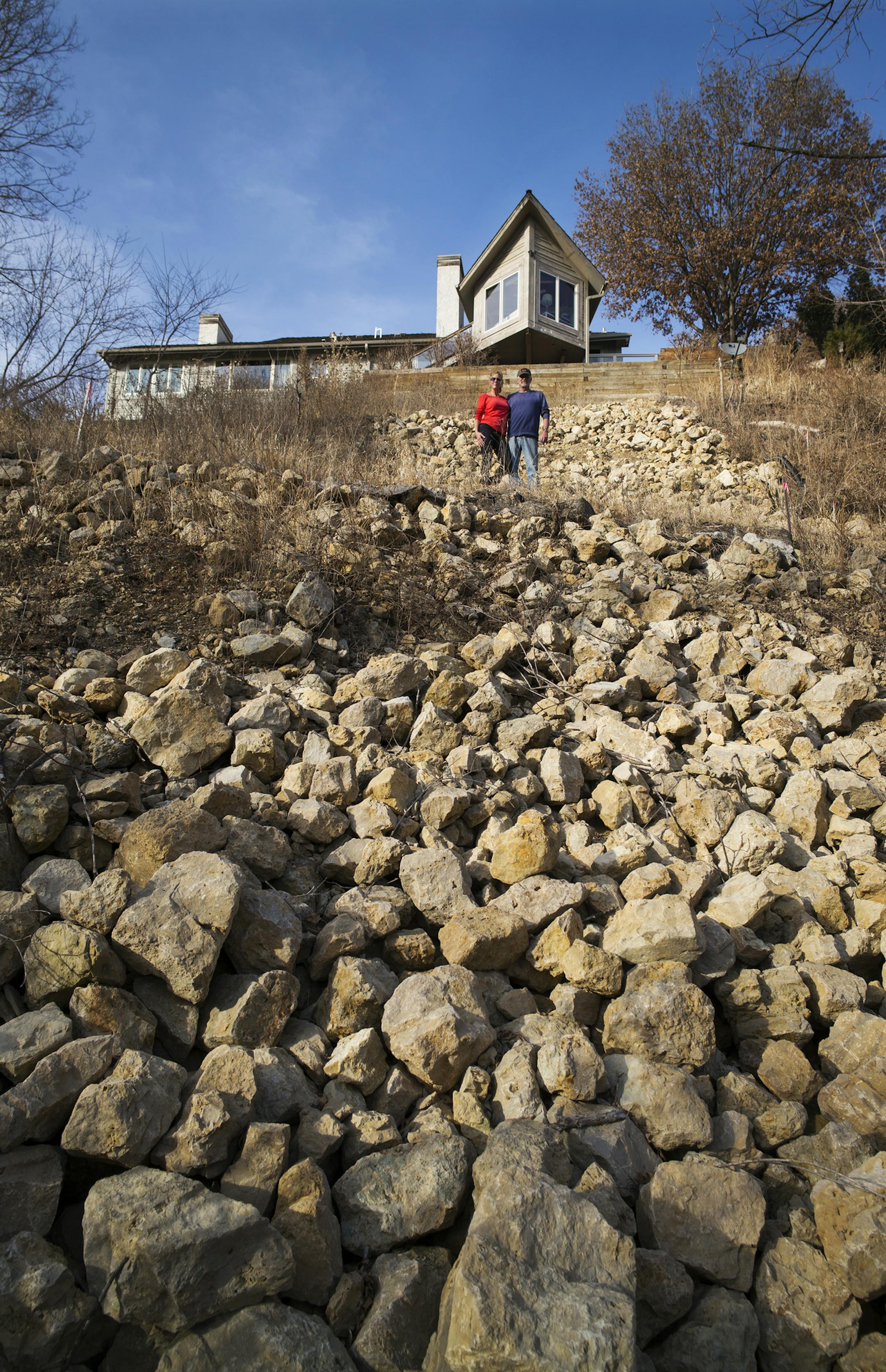 Wendy and Pat Gallagher had a dispute with the city of Eden Prairie as to who would pay for stabilizing the eroding hillside that leads from Purgatory Creek up to their home.]Richard Tsong-Taatarii/rtsong-taatarii@startribune.com