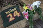 Hockey fans left a Derek Boogaard t-shirt and bundles of flowers outside of the Xcel Energy Center shortly after his death in 2011.