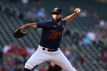 Minnesota Twins pitcher Devin Smeltzer throws during the first inning of the team's baseball game against the Cleveland Guardians on Saturday, May 14,