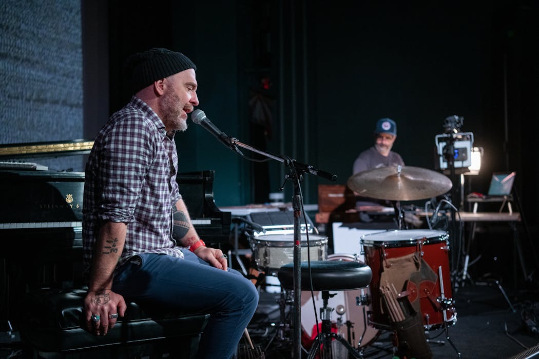 Photographer Alec Soth and drummer Dave King rehearse their new project, The Palms, at the Parkway Theater.