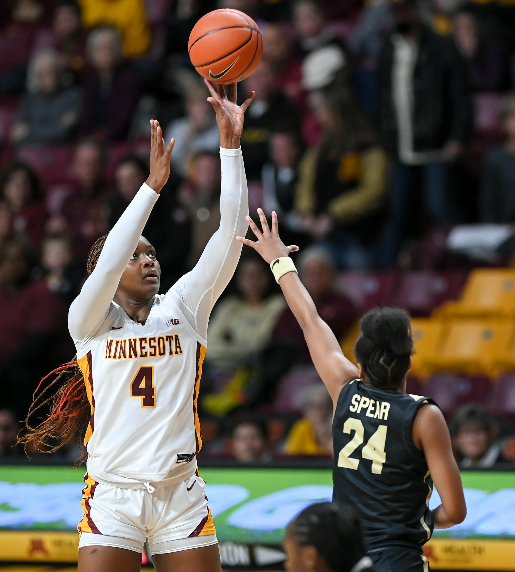 Minnesota Gophers forward Alanna Micheaux (4) atempts a shot against Wake Forest guard Jewel Spear (24) during the first half.