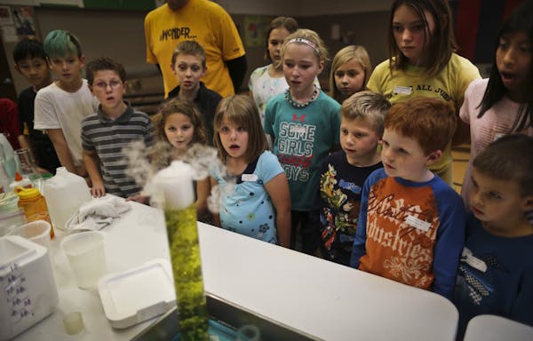East Union Elementary students watched a test tube change colors during an experiment making acid using dry ice in 2012. The school district is planni