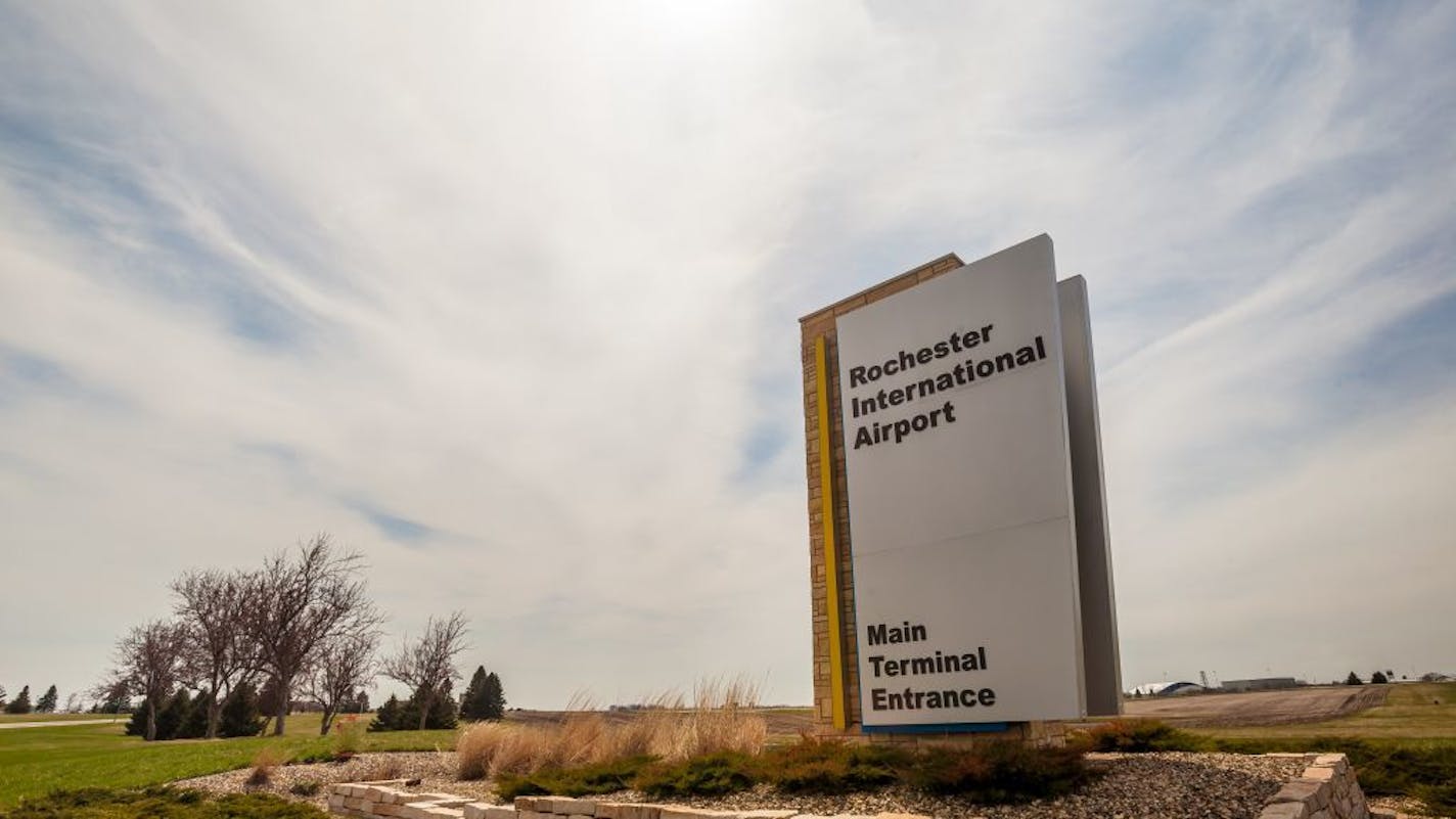 A sign out front signals the main terminal entrance to the Rochester International Airport.