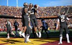 Gophers wide receiver Chris Autman-Bell (7) and wide receiver Rashod Bateman (13) celebrated Bateman's first-quarter touchdown against Maryland. Up ne