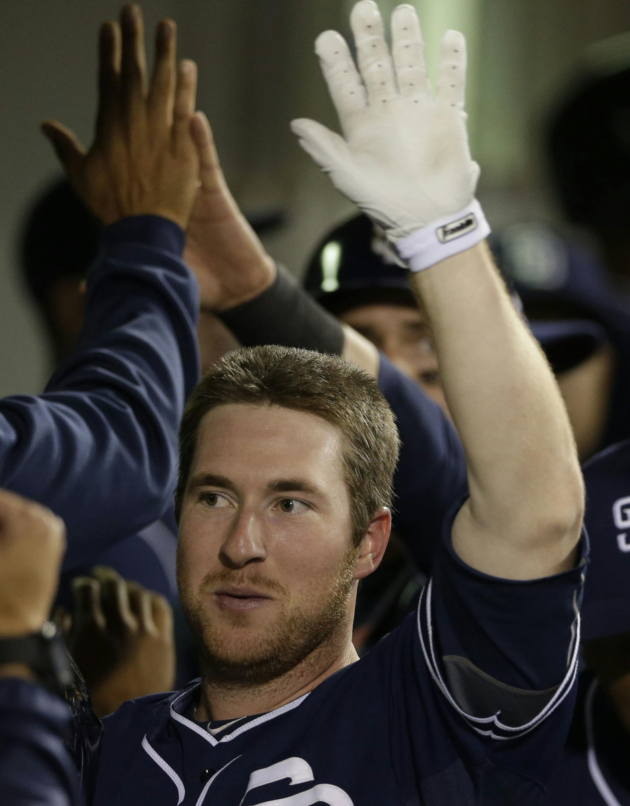 San Diego Padres' Jedd Gyorko, center is greeted after hitting a two-run home run against the Arizona Diamondbacks during the ninth inning of a baseball game Saturday, May 3, 2014, in San Diego.The Diamondbacks won, 4-3. (AP Photo/Gregory Bull) ORG XMIT: CAGB10