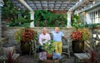 Beautiful Gardens winners Tom Hoch, left and Mark Addicks, relax in an outdoor room sheltered by a pergola and limestone wall. Over the past four year