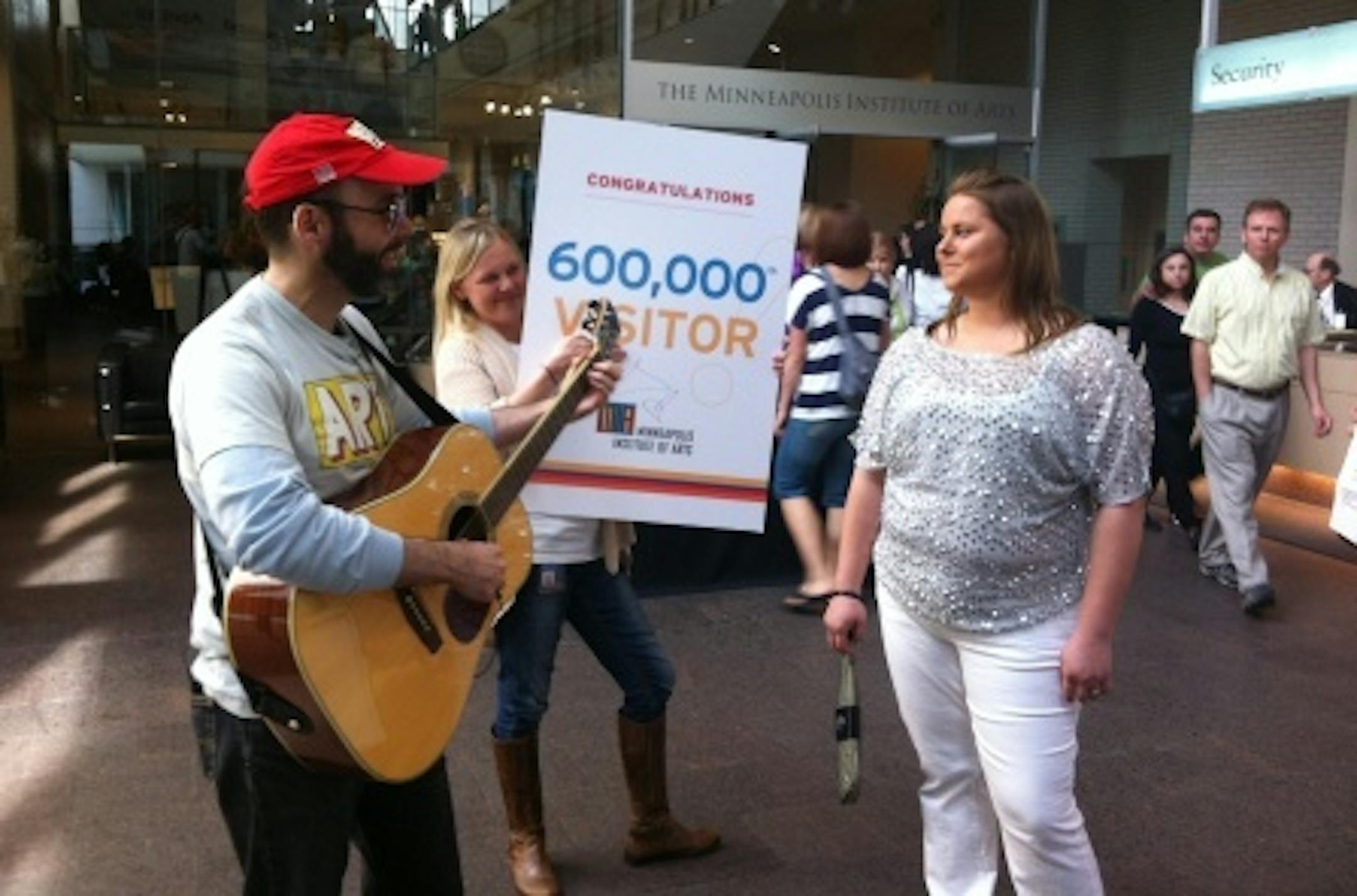 Lauren, 600,000th visitor being welcomed Sunday at the Minneapolis Institute of Arts.