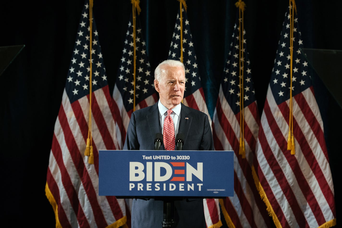 FILE -- Former Vice President Joe Biden, a Democratic for president, speaks at a news conference in Wilmington, Del., on March 12, 2020. Biden, confronting questions over his lack of visibility during a crisis that has upended the presidential primary, on Monday, March 23, 2020, pressed President Donald Trump to step up his response to the coronavirus. (Hannah Yoon/The New York Times)