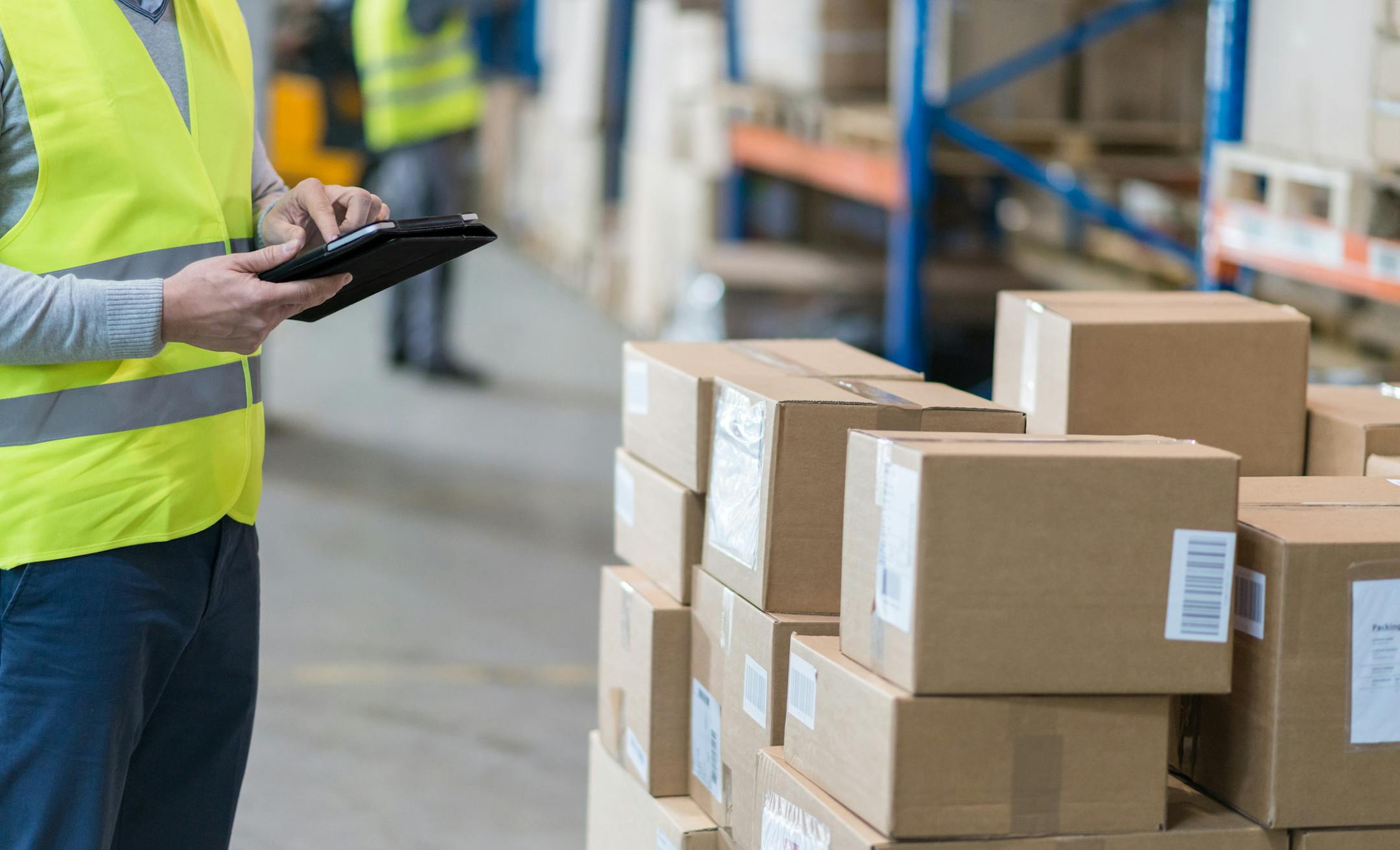 iStock
Male Warehouse Employee Doing Inventory Check In Warehouse.